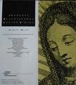 Close-up of a printed page with text on white paper and a partial black-and-white illustration of a woman's face with curly hair next to it.