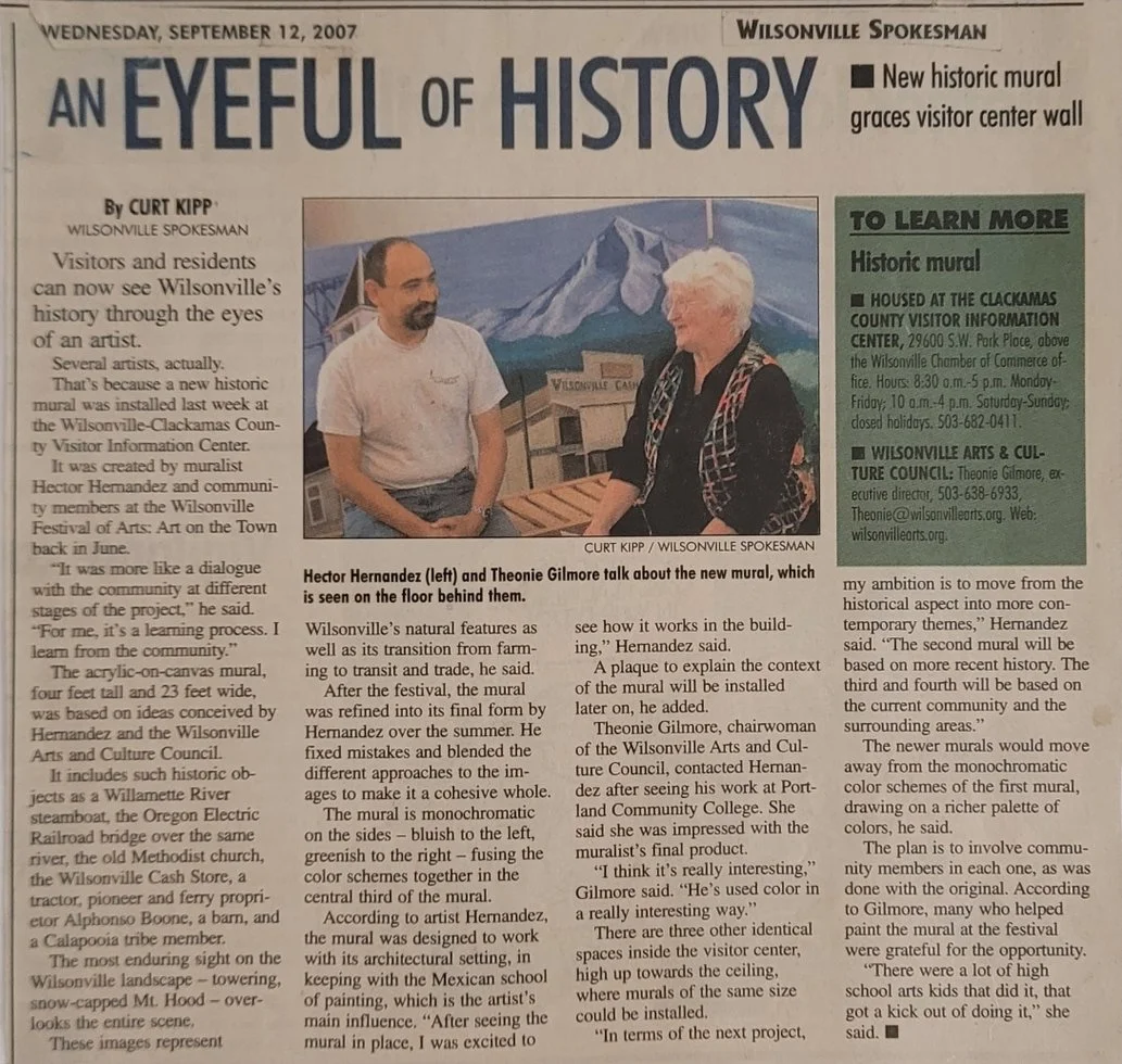 Newspaper article about the unveiling of a historic mural in Wilsonville. The article features a photo of two people, Hector Hernandez and Theonie Gilmore, discussing the mural behind them.