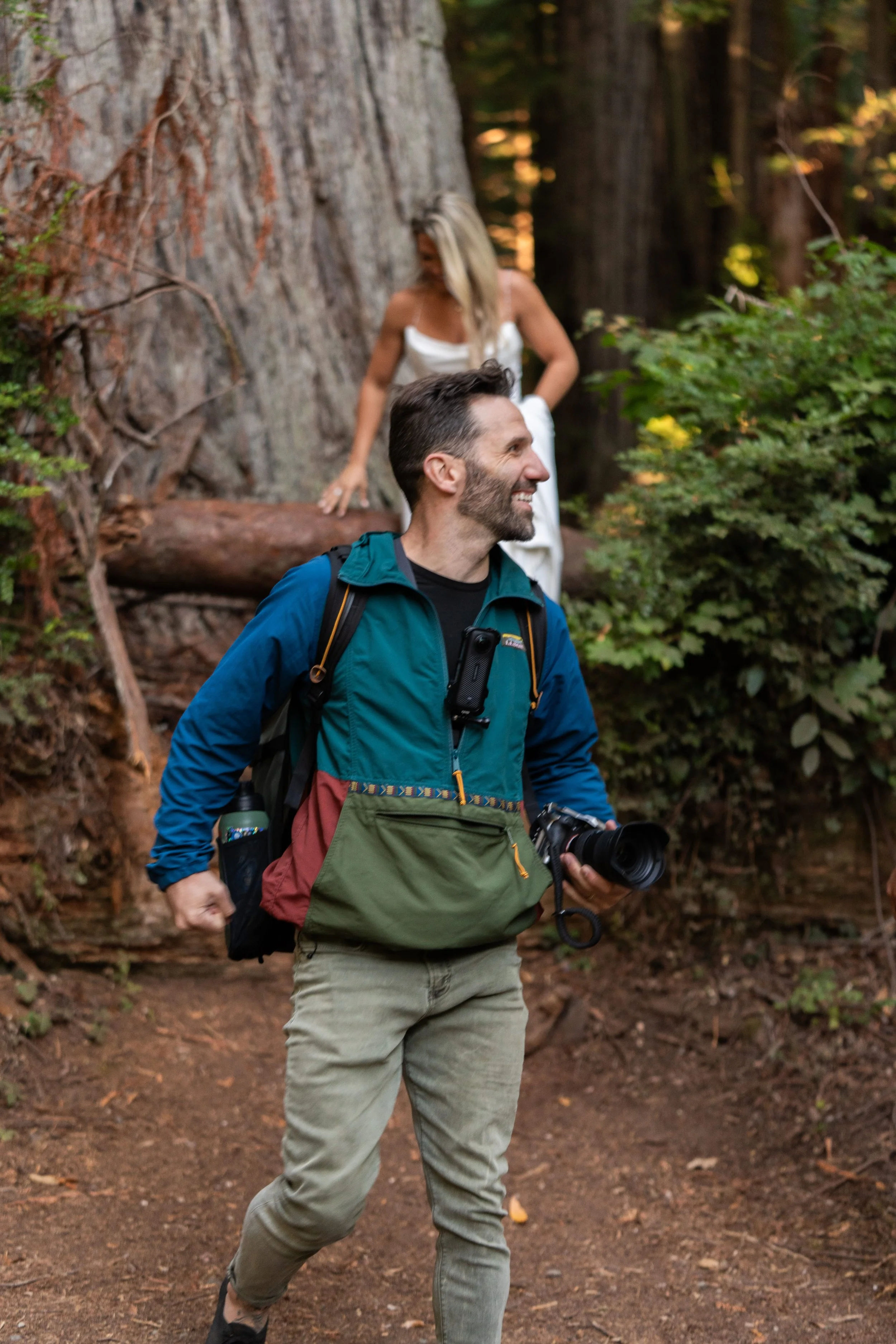 Paul Adams, Photographer, smiling after a photo taken in Red Woods Colorado.  This is a candid moment showing the joy he gets from his job.