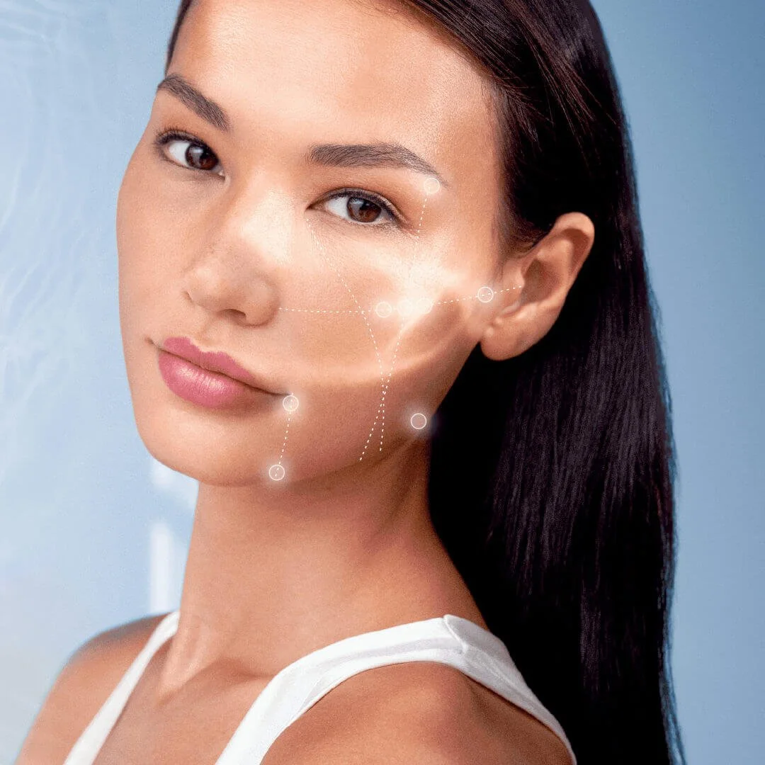 Client portrait with a facial assessment graphic across the cheek and jawline.