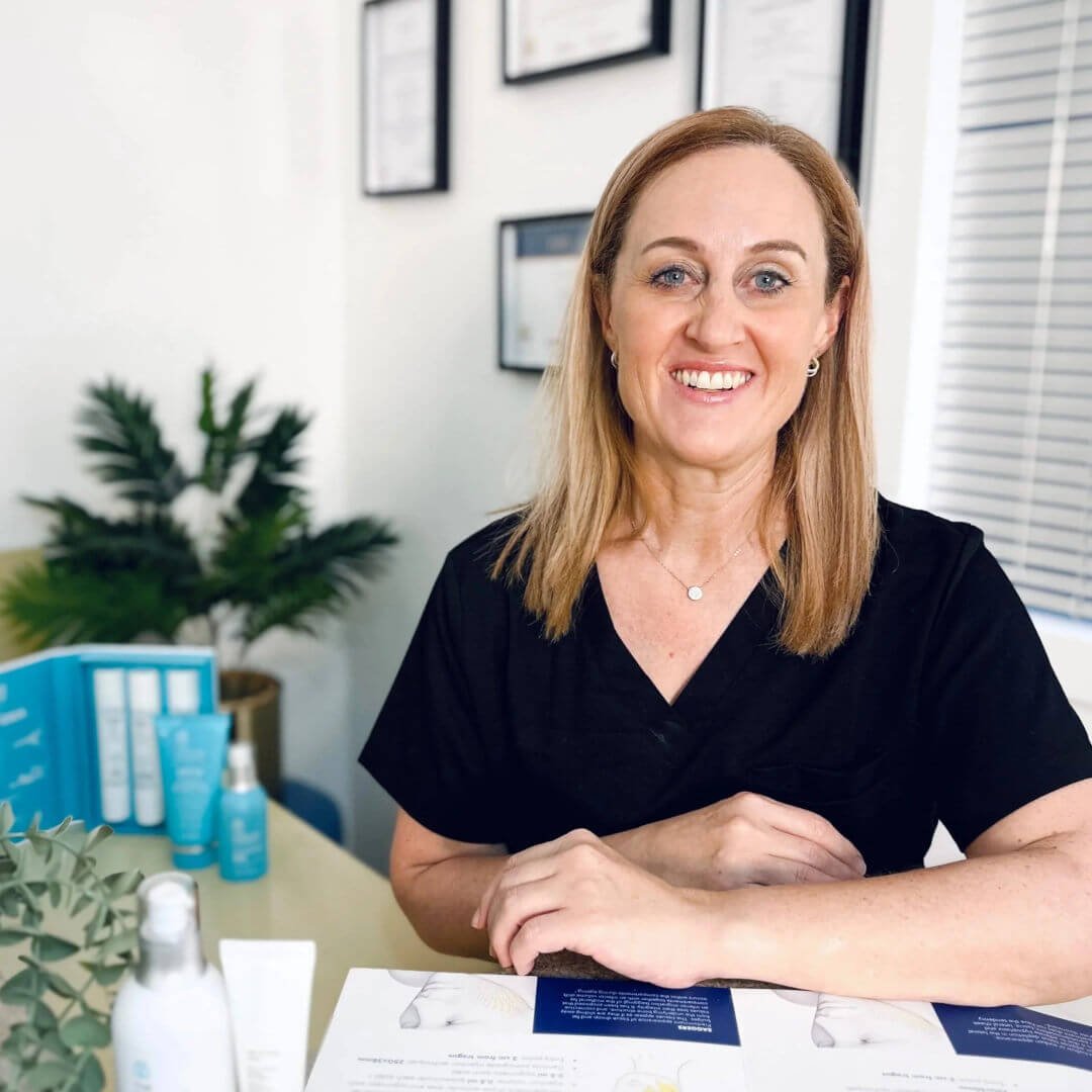Registered Nurse Jolieta in the Beauty Within Aesthetics consultation room.