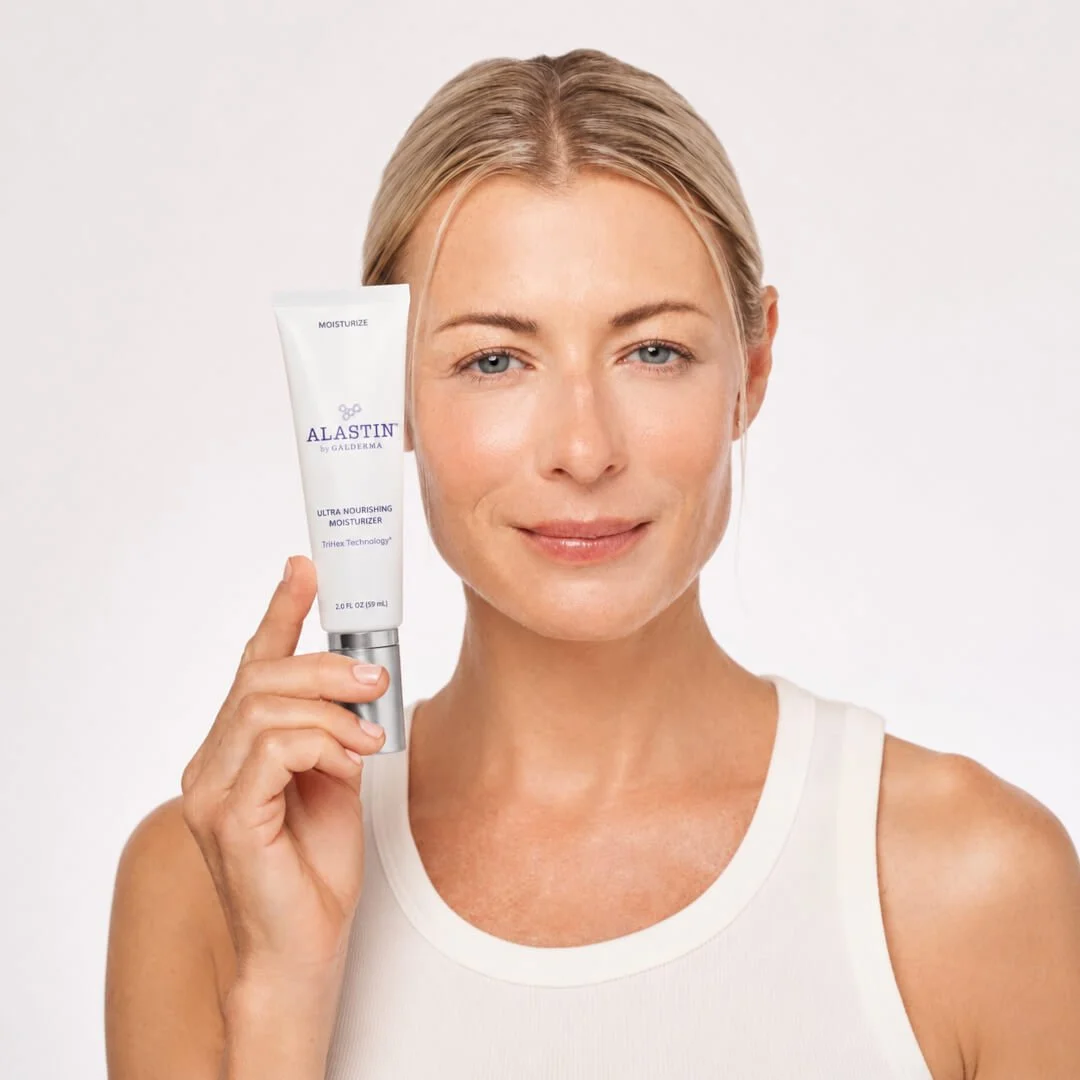 Model holding Alastin Ultra Nourishing Moisturiser with TriHex Technology®.
