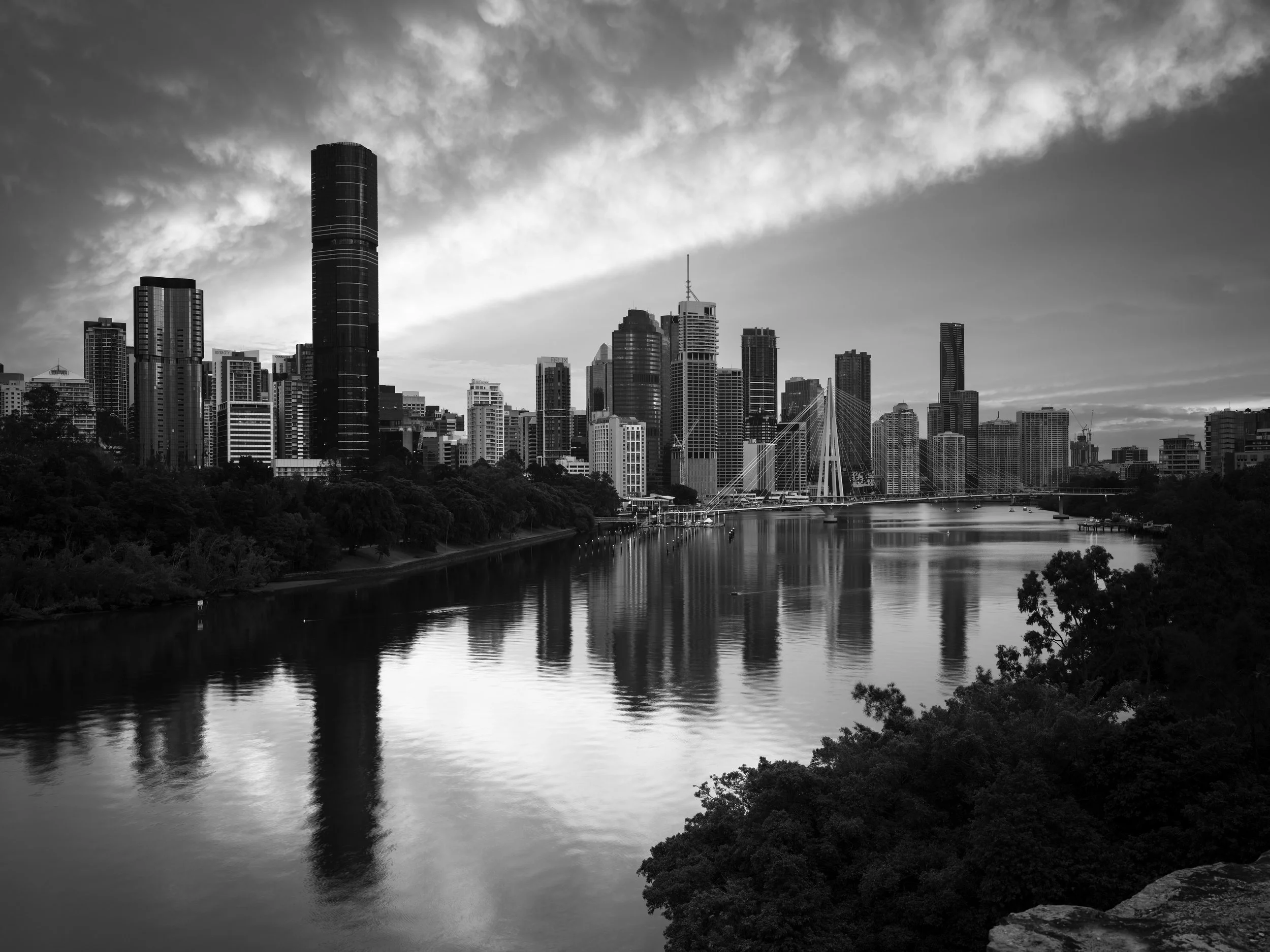 Black and white photo of Brisbane's cityscape during sunrise