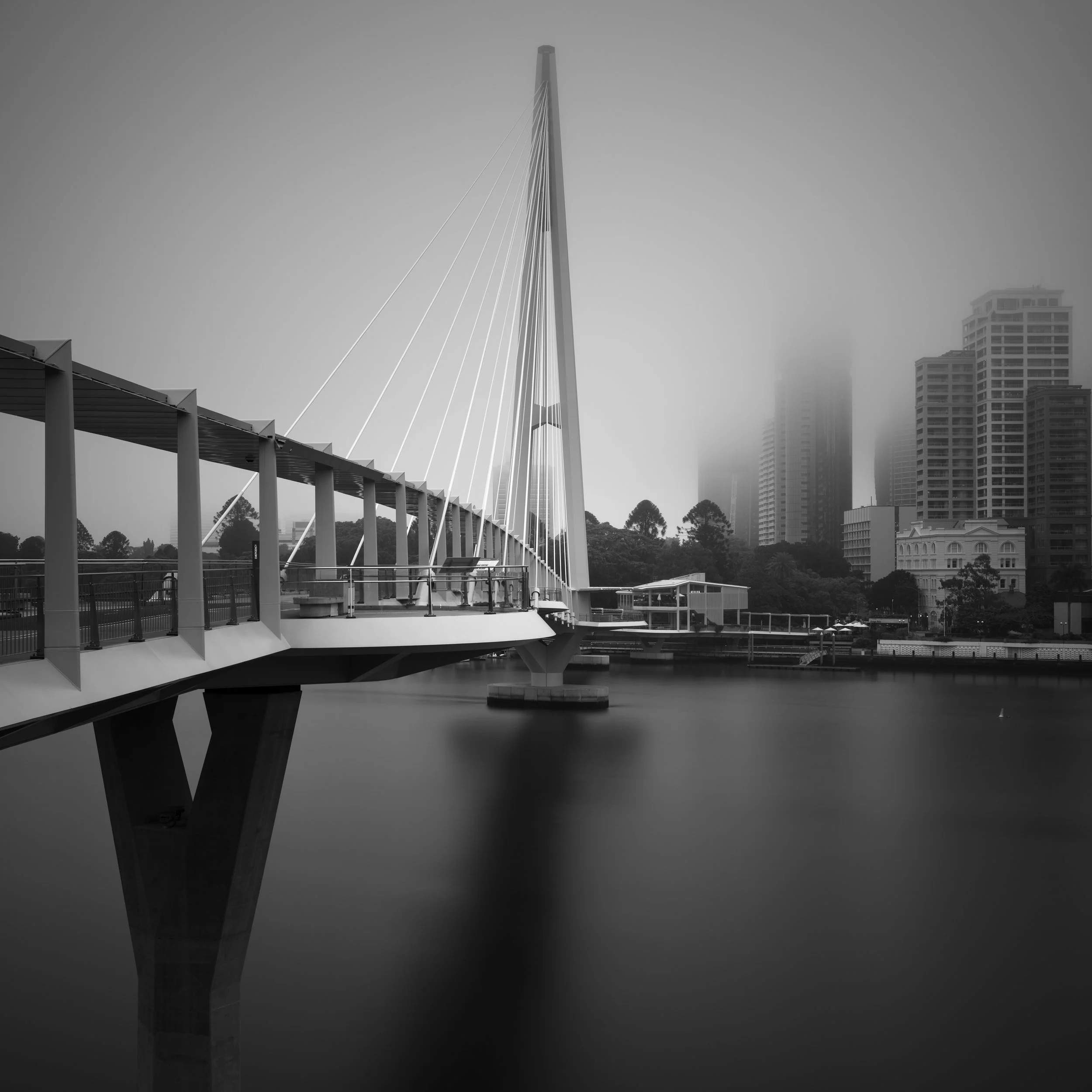 Black and white photo of Kangaroo Point Bridge in fog