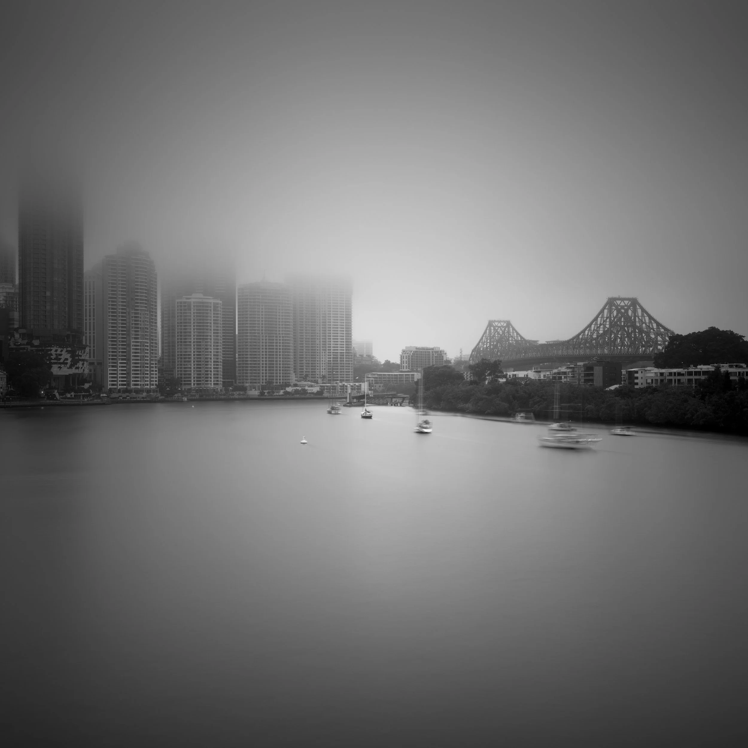Black and white photo of Brisbane's cityscape in fog