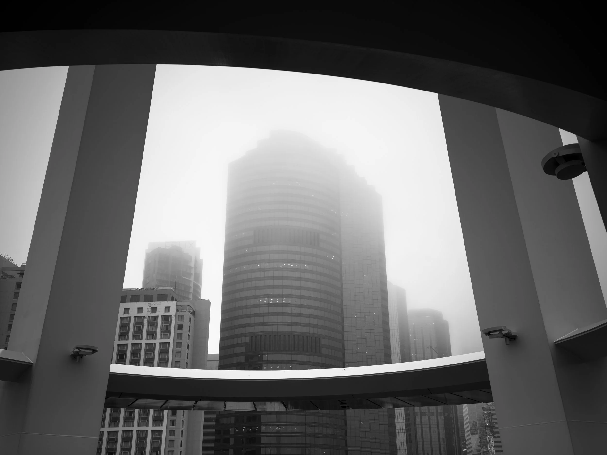 Black and white photo of Brisbane's cityscape in fog