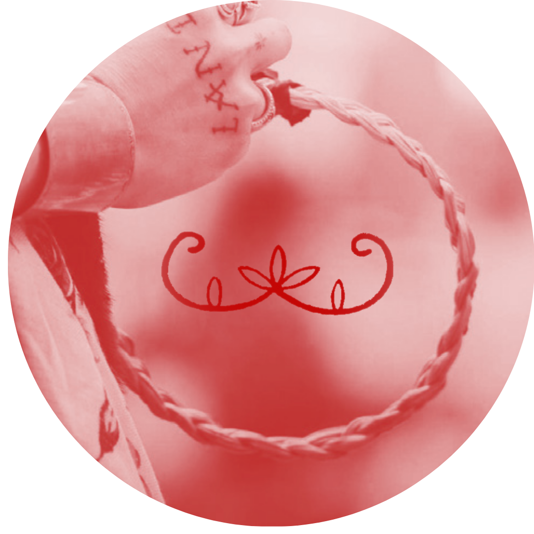 Close-up of a person's hand holding a thick twisted rope, with a decorative red swirl design in the background.