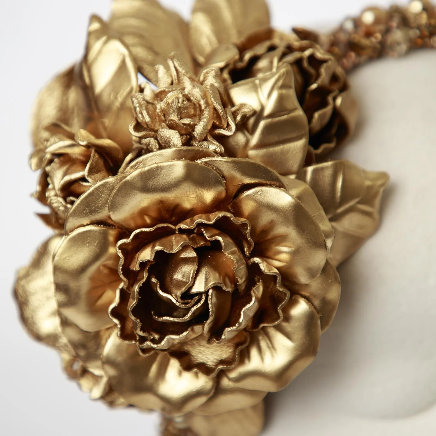 drew-gold-leather-detail-flower.jpg