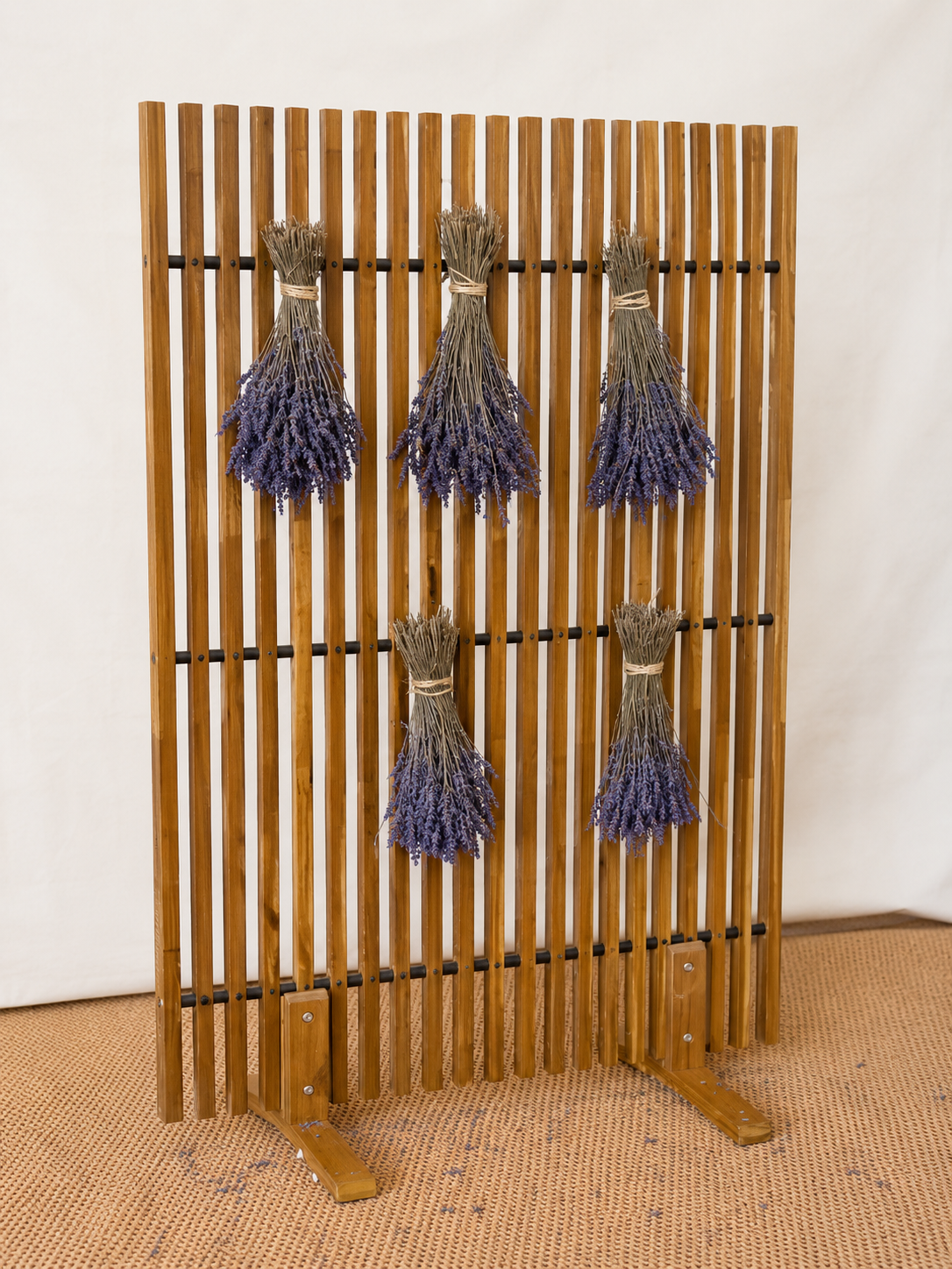 Lavender bunches on wooden stand.png