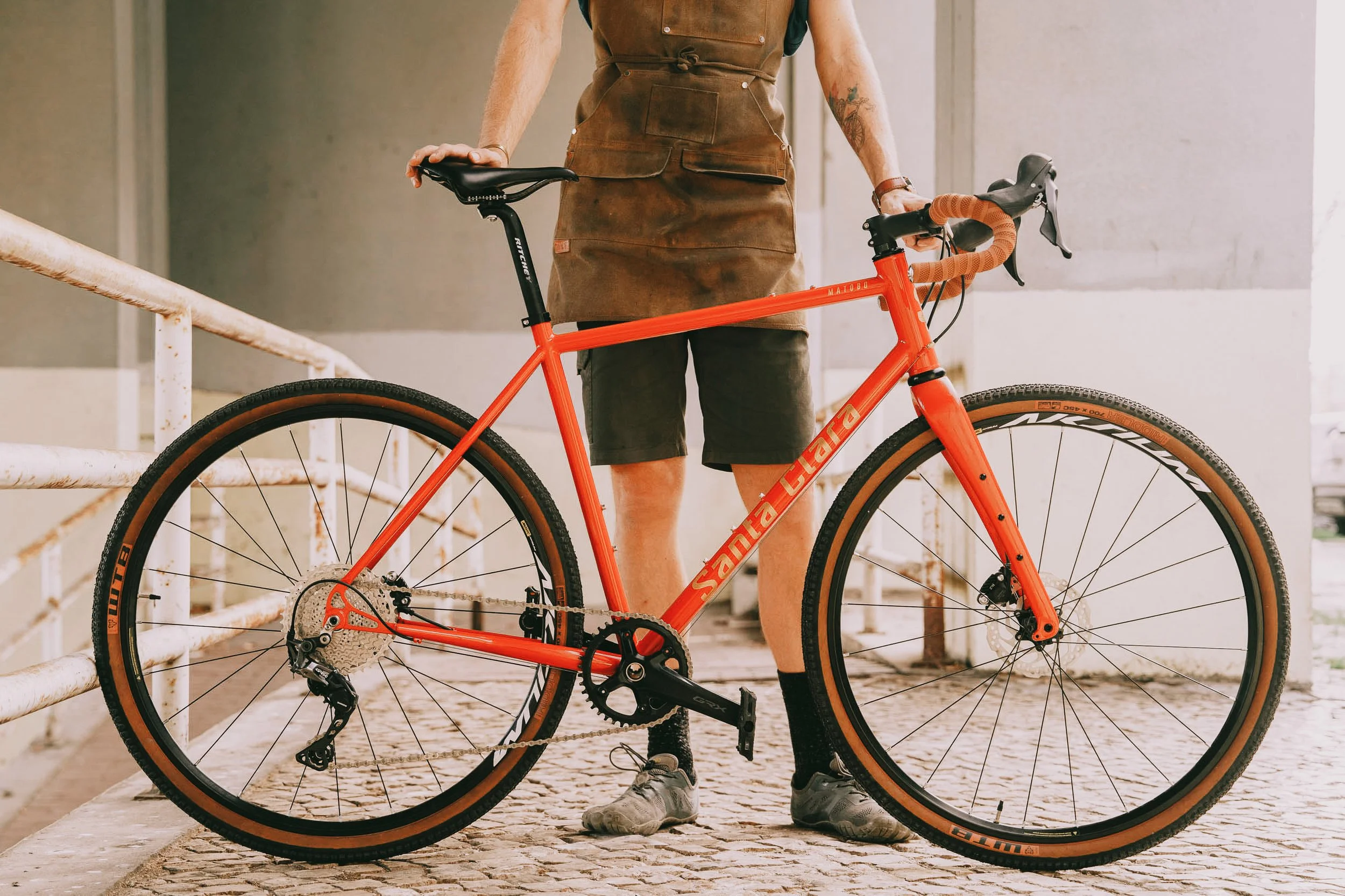 Man Holding Red Handmade Bike