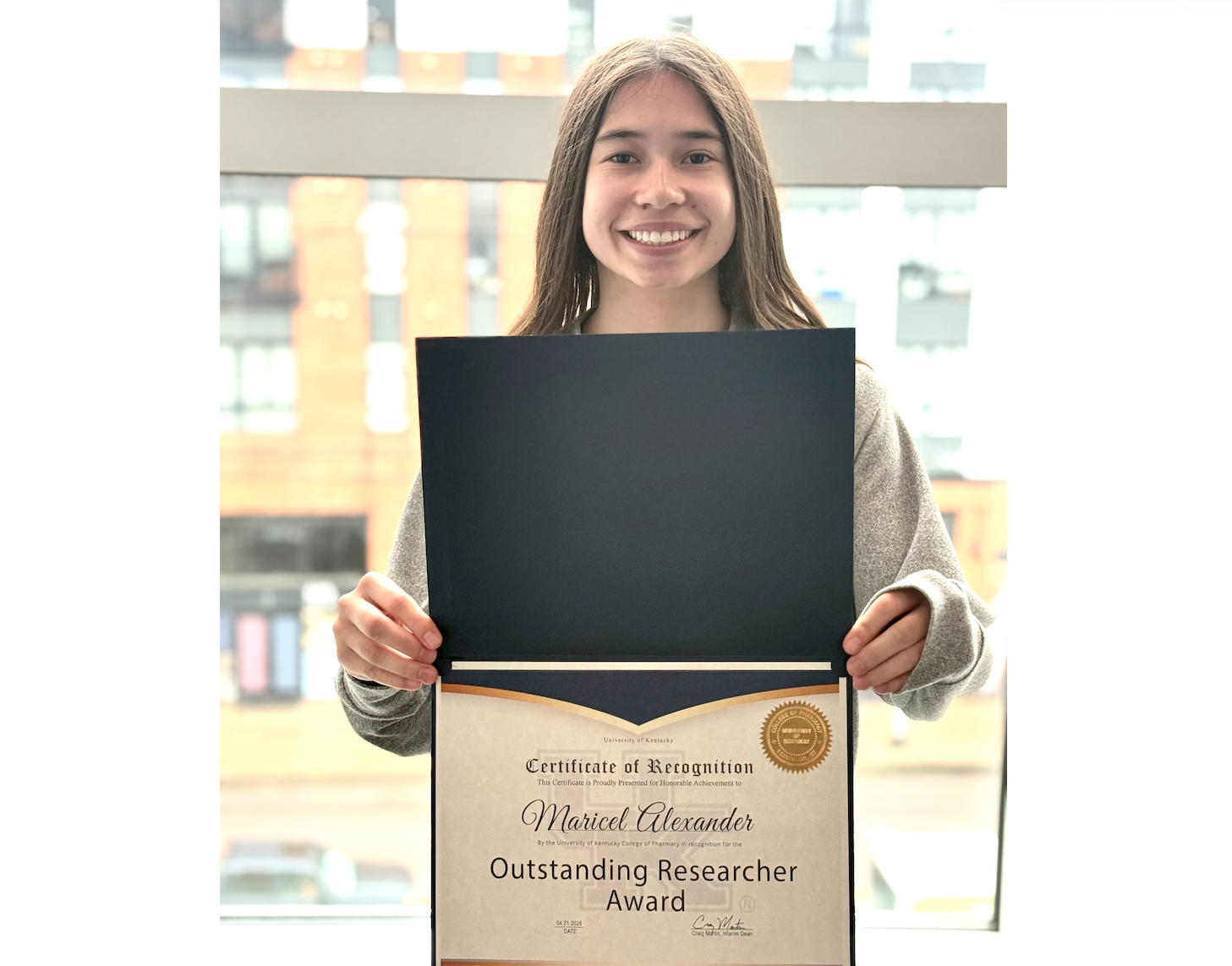 Maricel Alexander received an award for Outstanding Researcher in undergraduate study