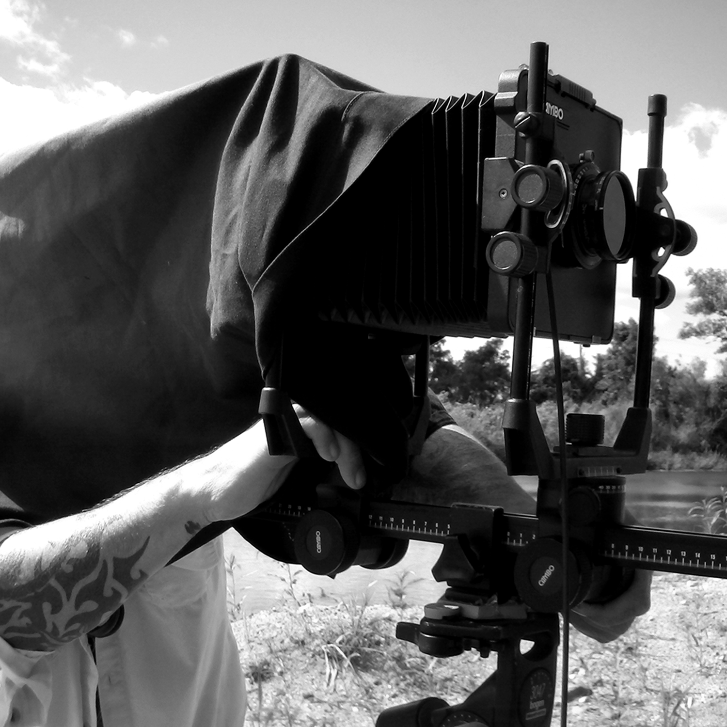 Photographic artist Shannon Graham behind a 4x5 view camera on location.