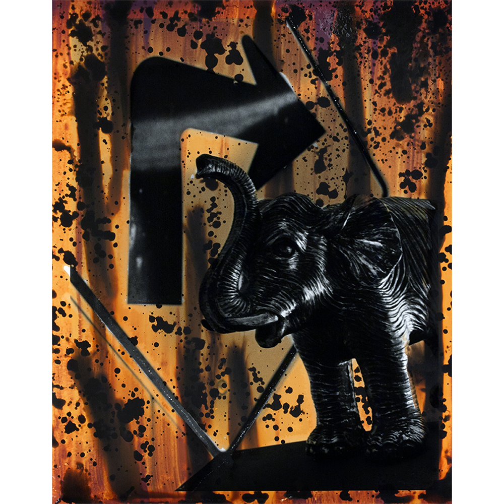 Still life chemigram silver gelatin print of elephant and arrow in bright orange colors.