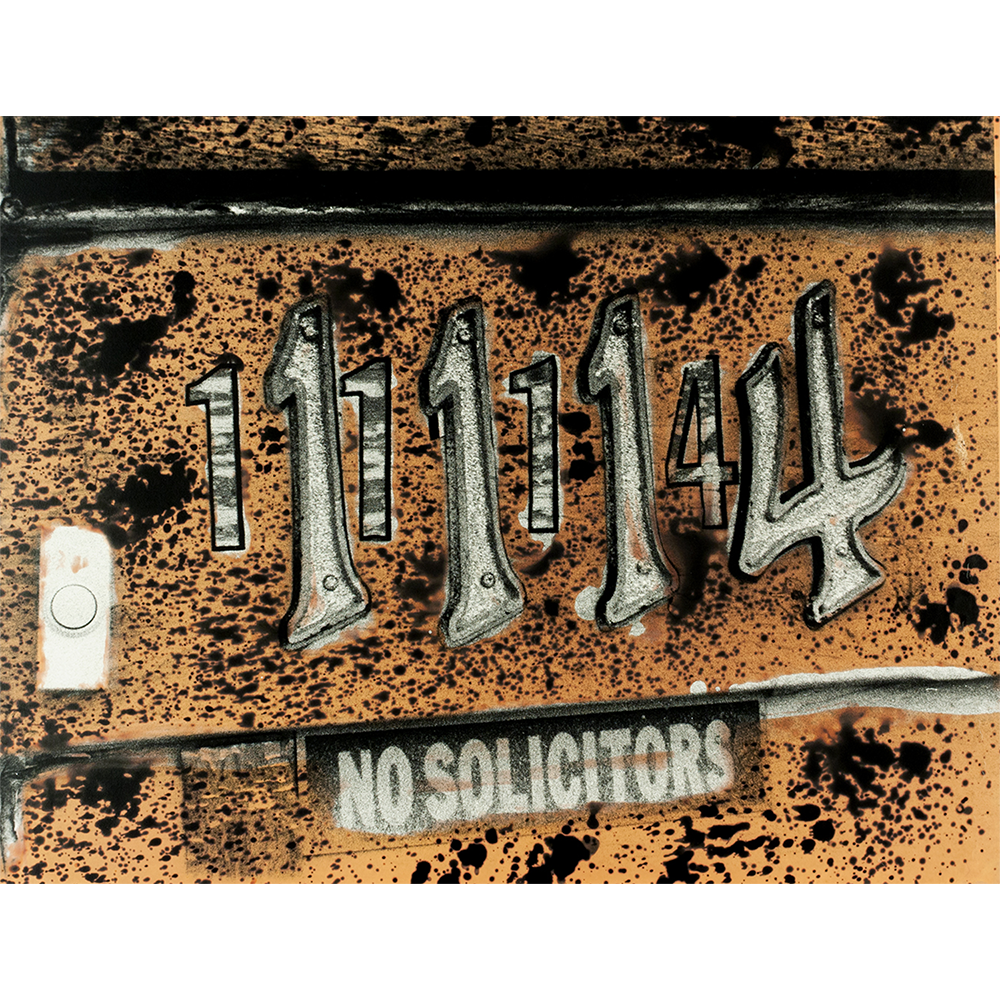 House with numbers by front door in bold orange abstract hand-printed chemigram photograph.