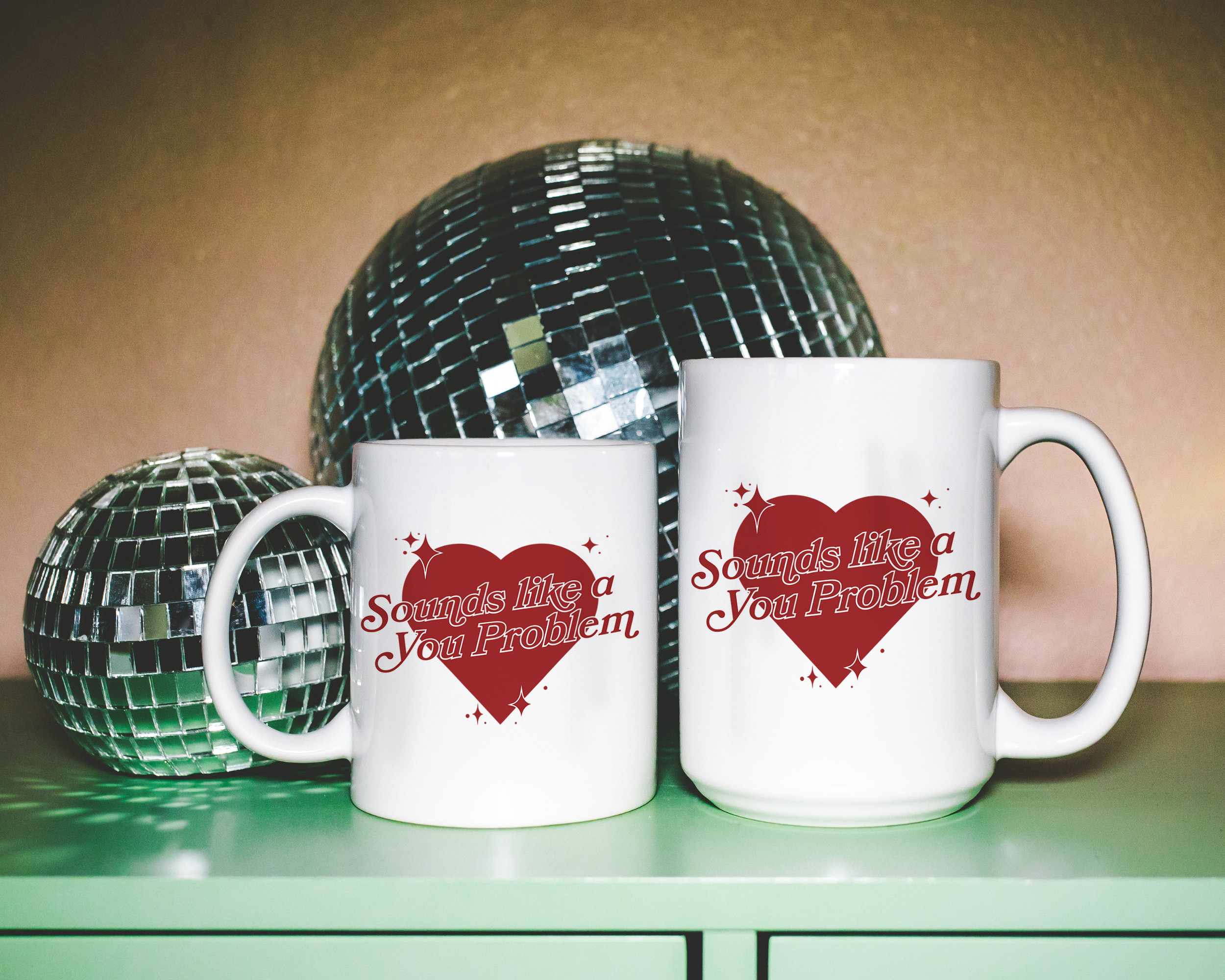 Sassy dopamine decor White coffee mug that says "Sounds like a you problem" in a retro vintage style heart that's red with a retro font.. Available in 11oz and 15oz