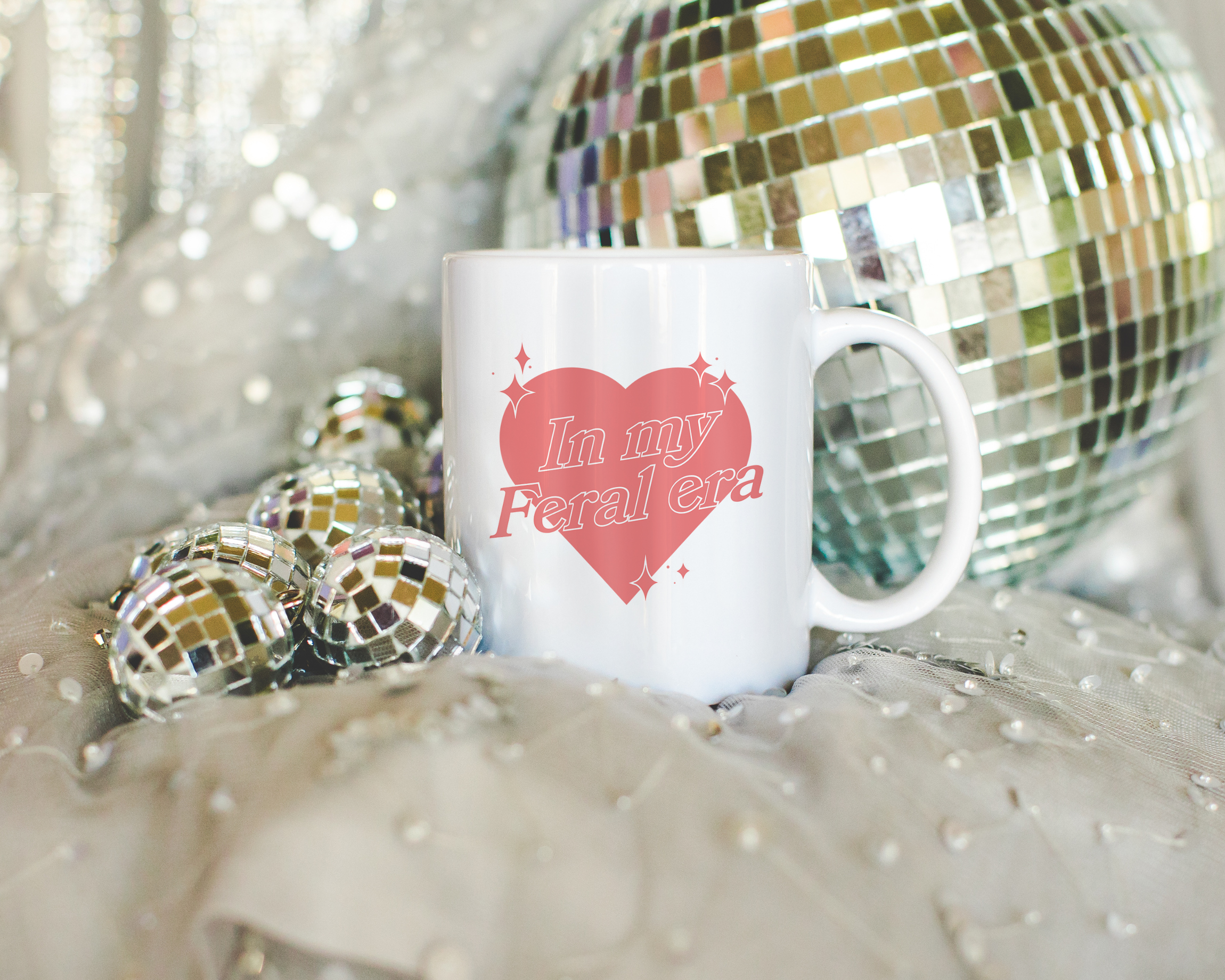 Sassy dopamine decor White coffee mug that says "In my feral era" in a retro vintage style heart that's pink with a retro font.. Available in 11oz and 15oz