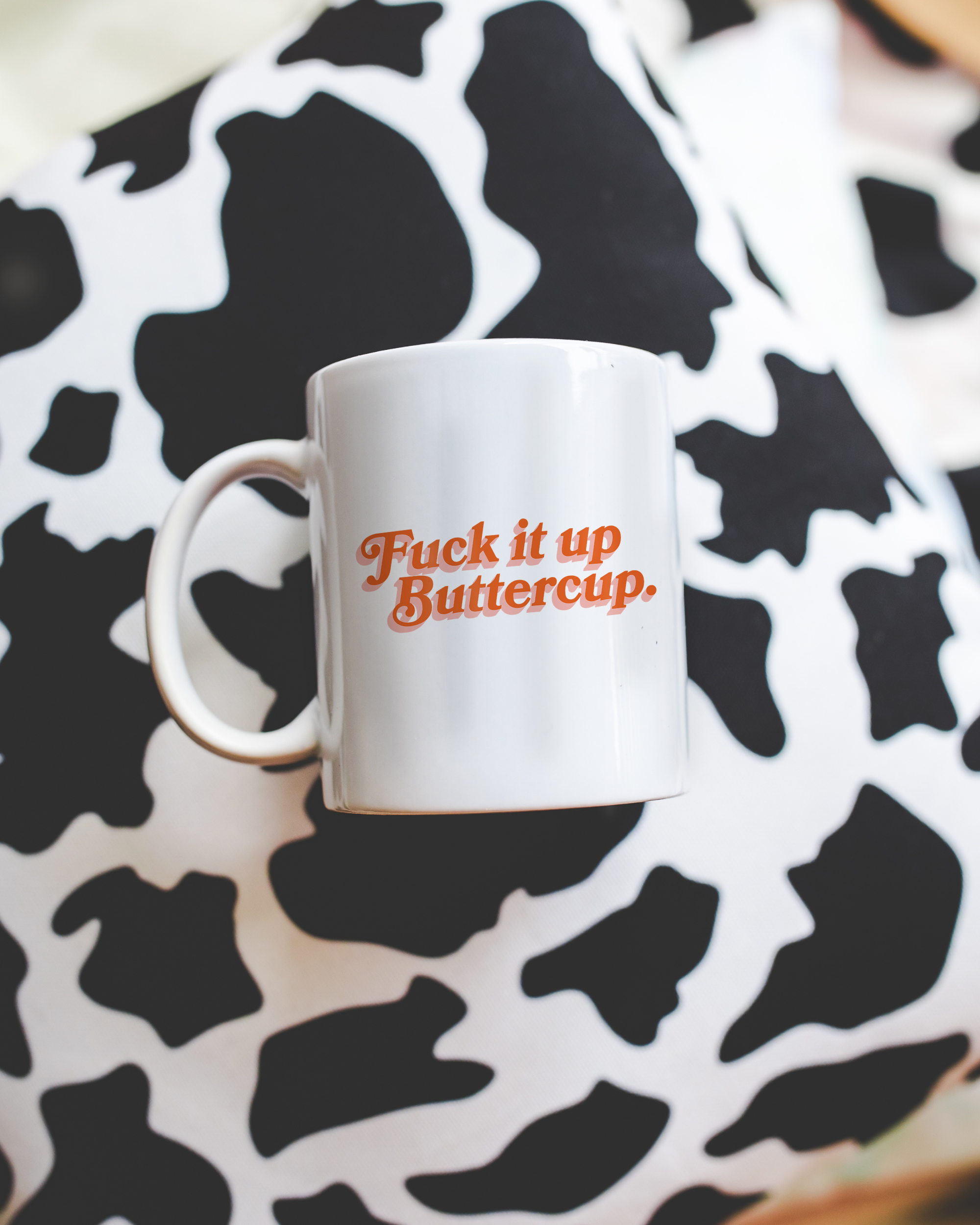 Sassy dopamine decor White coffee mug that says "Fuck it up buttercup" in a retro vintage font that's orange. Available in 11oz and 15oz