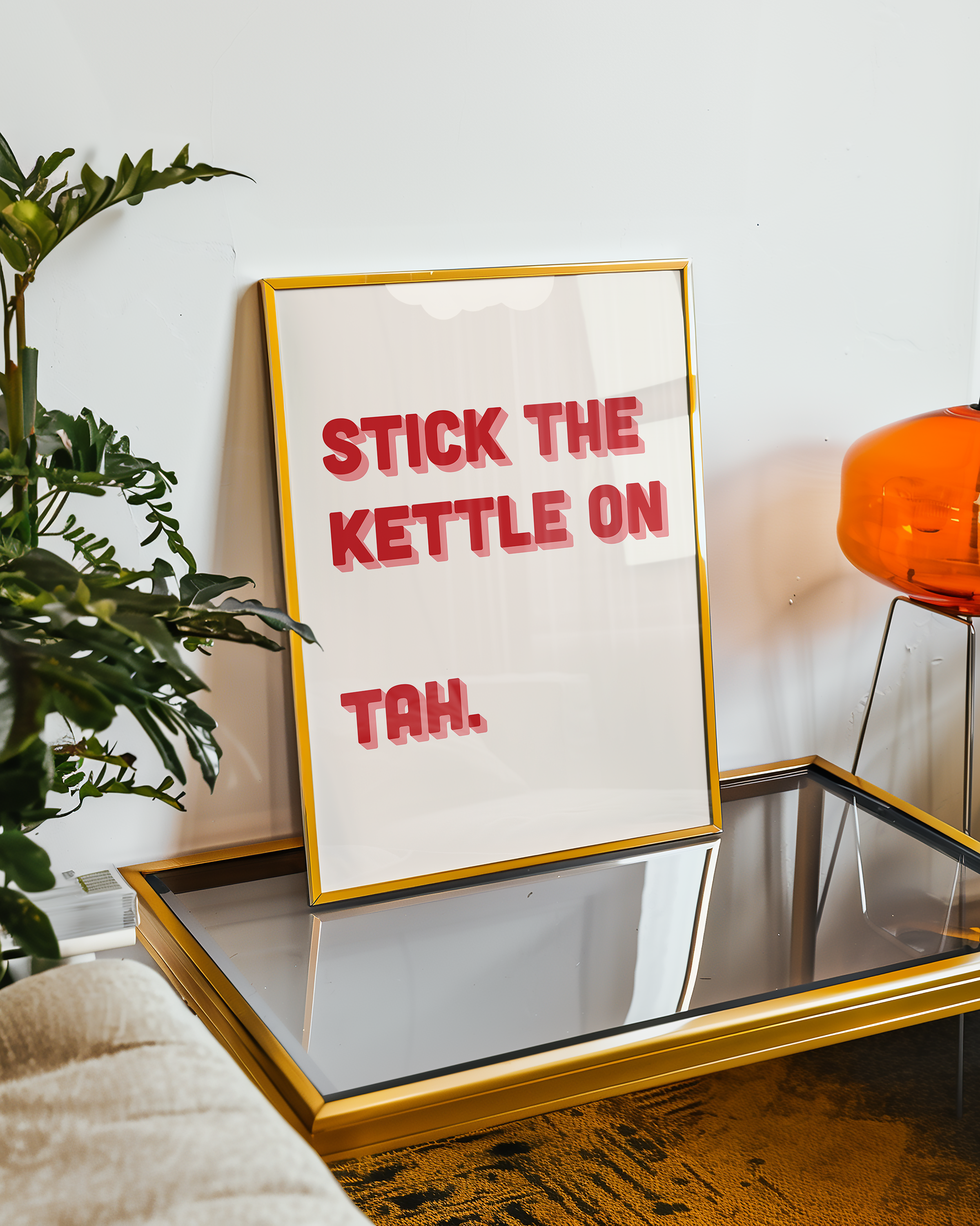 Funny quote print poster that says "Stick the Kettle On Tah" in two tone retro red and pink font. British humour poster
