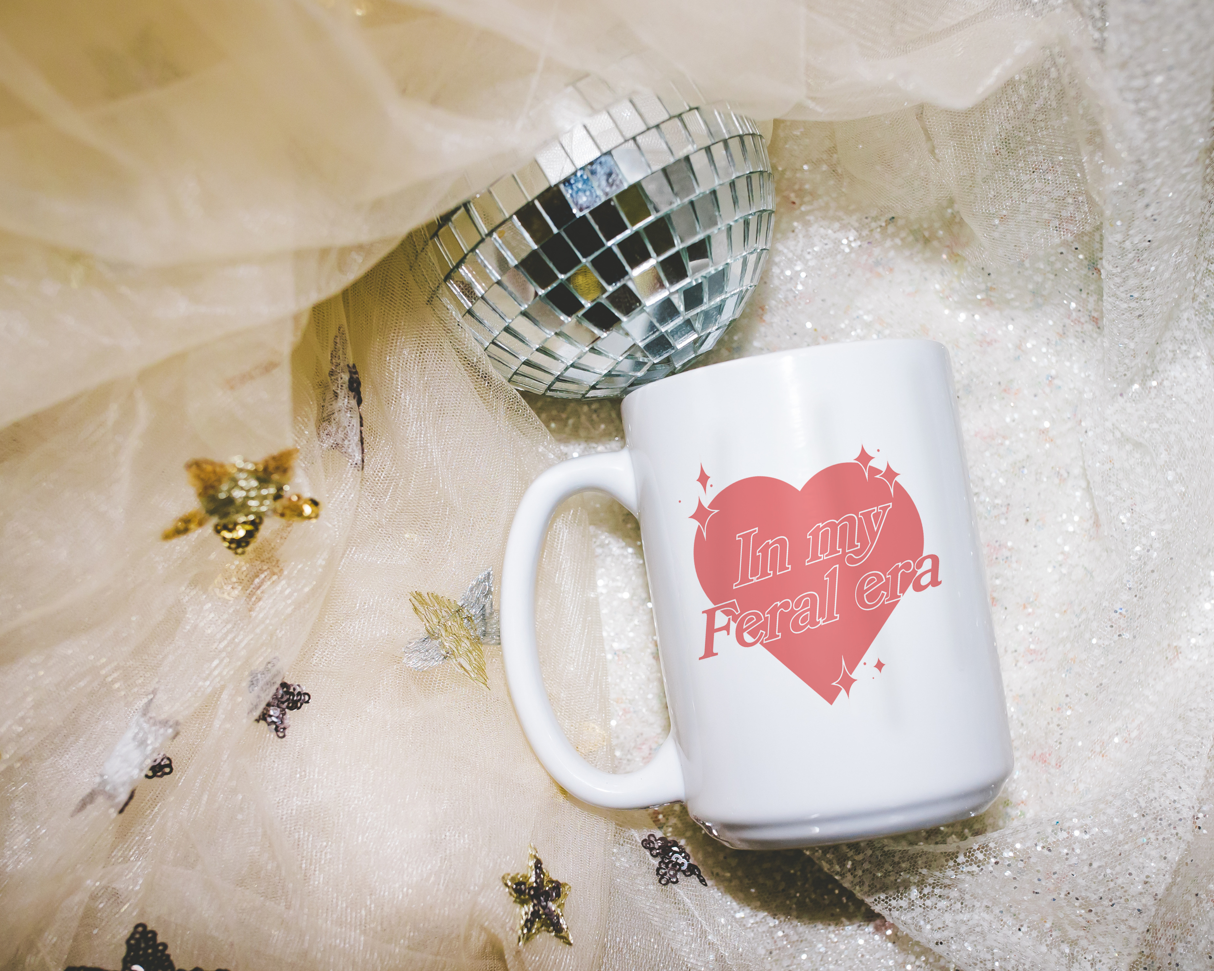 Sassy dopamine decor White coffee mug that says "In my feral era" in a retro vintage style heart that's pink with a retro font.. Available in 11oz and 15oz
