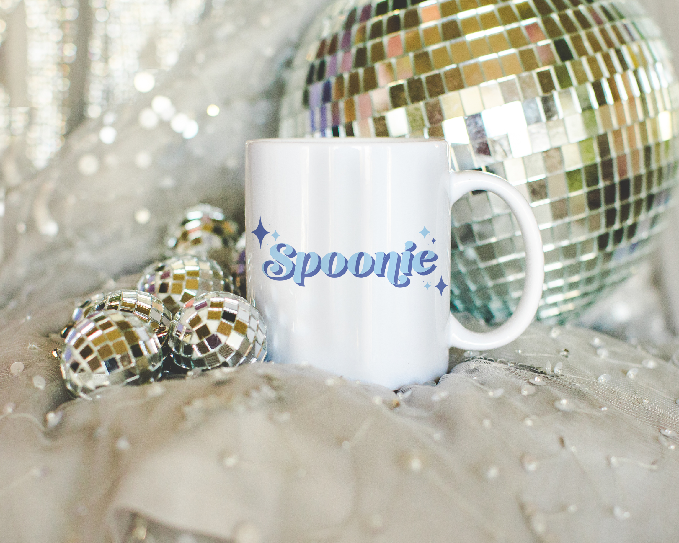 Sassy dopamine decor White coffee mug that says "Spoonie" in a retro vintage style blue font. Available in 11oz and 15oz