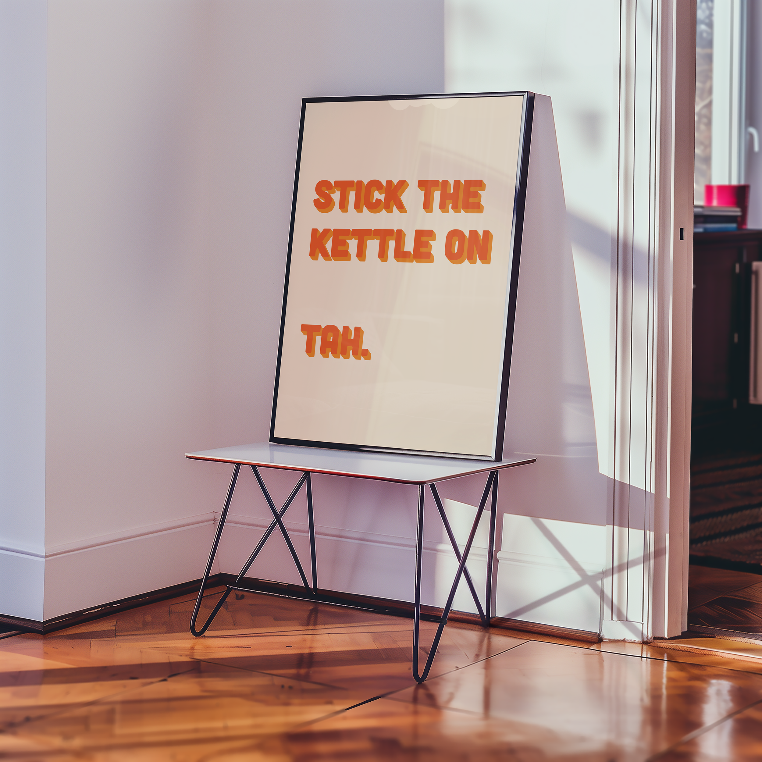 Funny quote print poster that says "Stick the Kettle On Tah" in two tone retro orange font. British humour poster