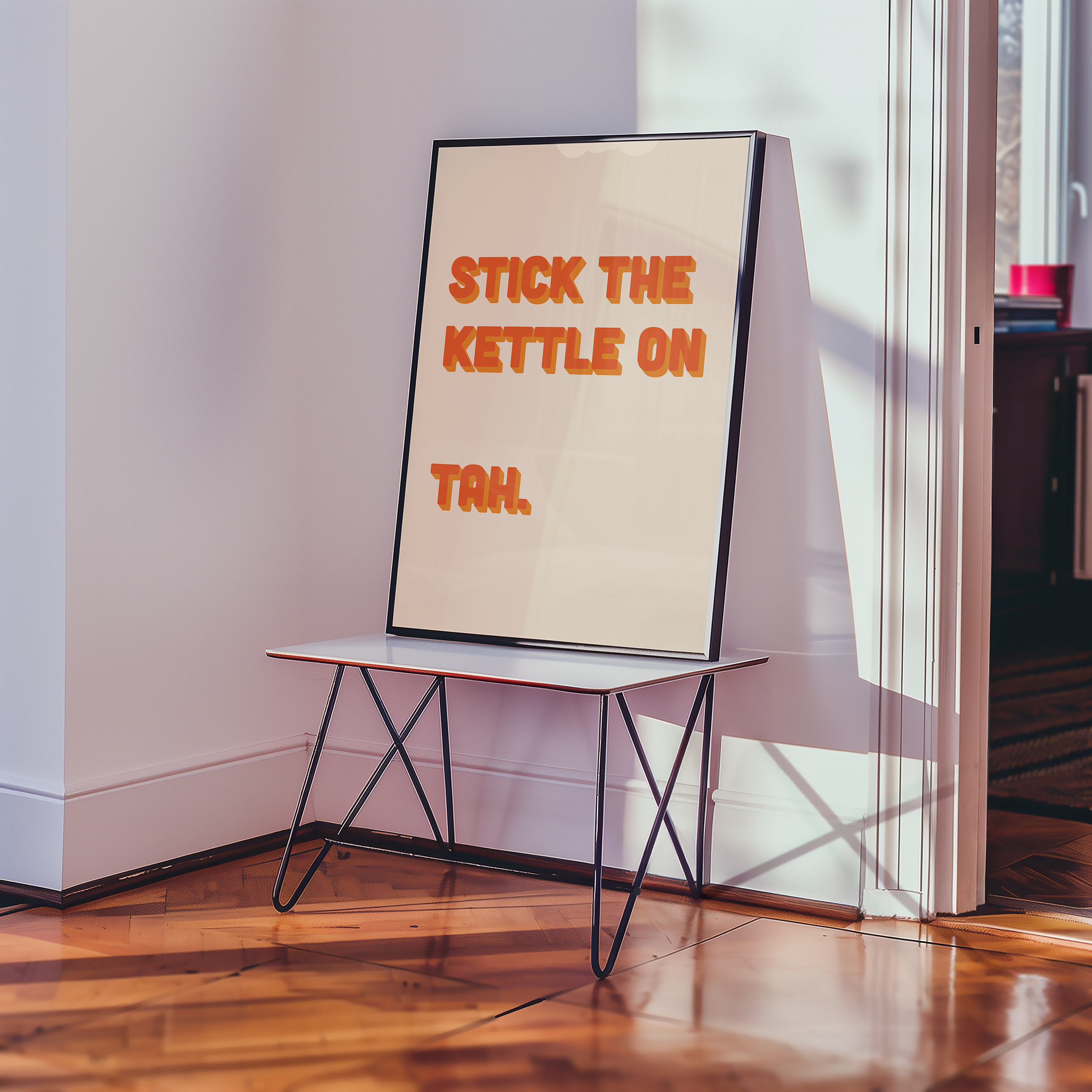 Funny quote print poster that says "Stick the Kettle On Tah" in two tone retro orange font. British humour poster