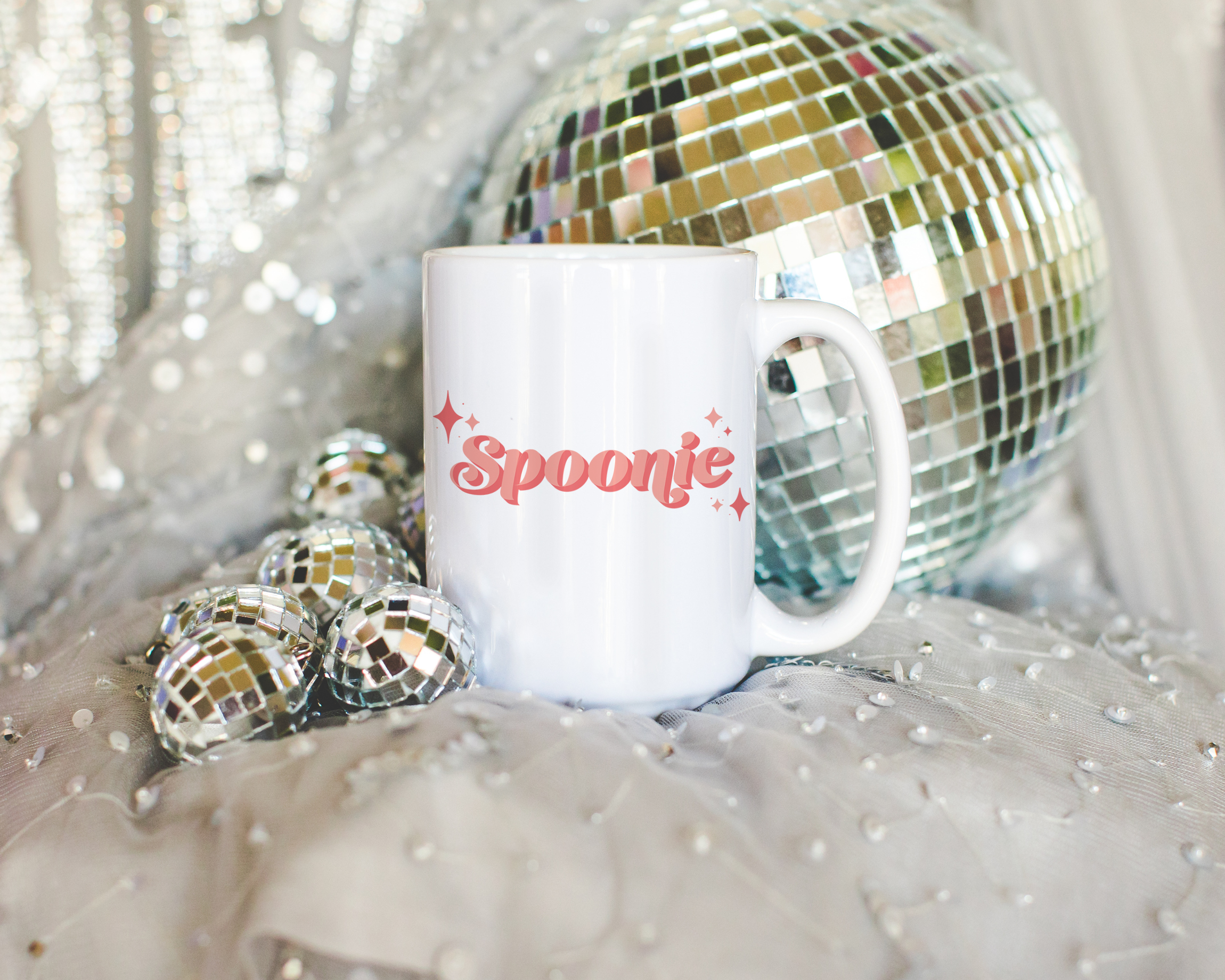 Sassy dopamine decor White coffee mug that says "Spoonie" in a retro vintage style pink font. Available in 11oz and 15oz