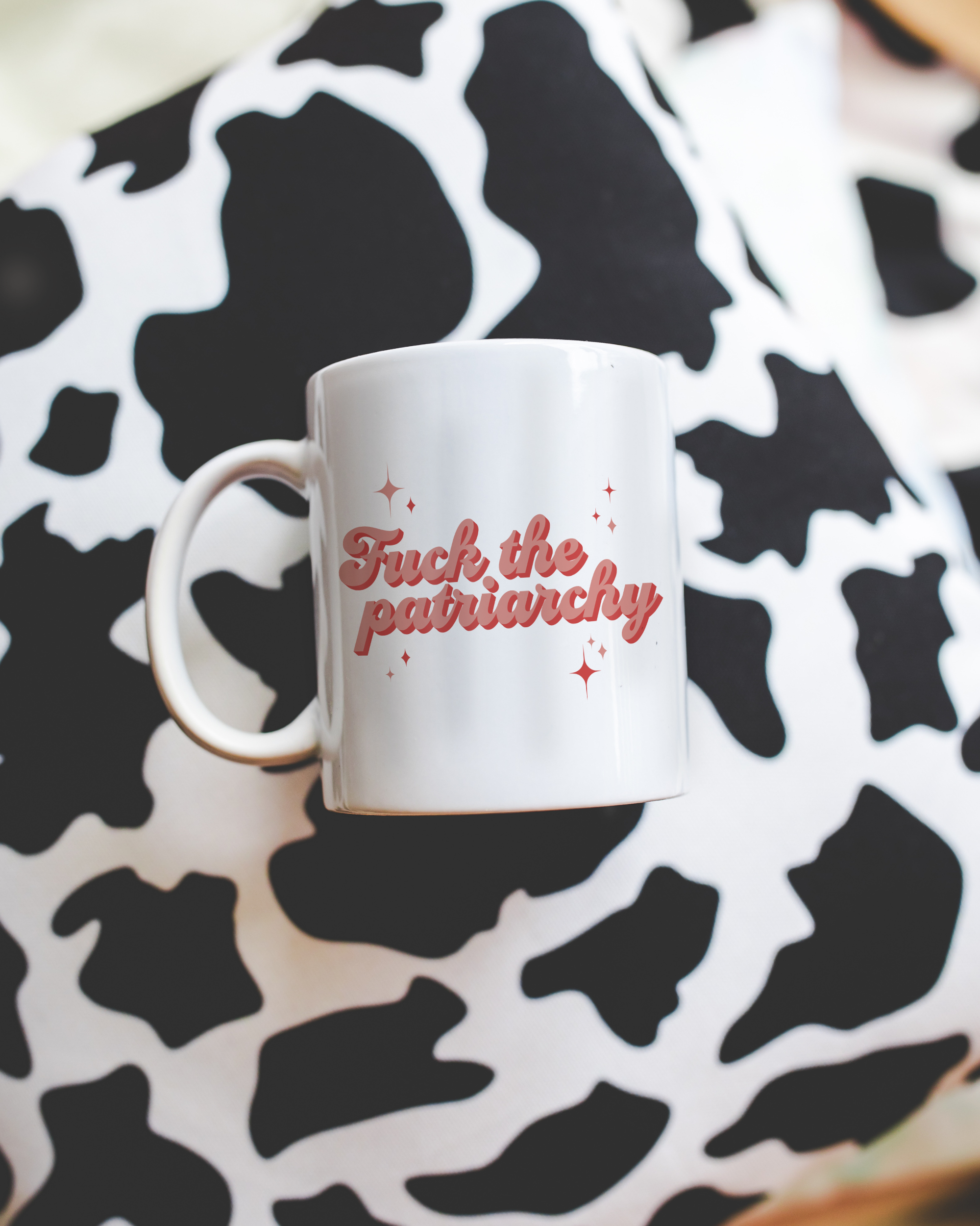 Sassy dopamine decor White coffee mug that says "fuck the patriarchy" in a retro vintage style red font. Available in 11oz and 15oz