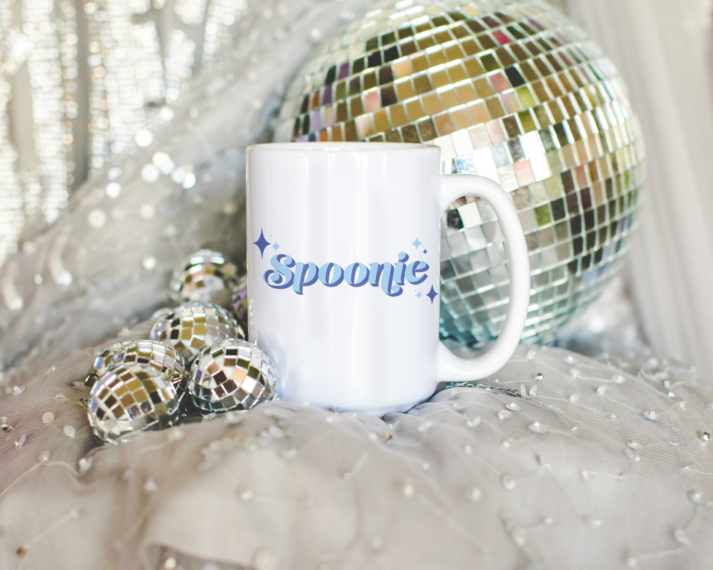 Sassy dopamine decor White coffee mug that says "Spoonie" in a retro vintage style blue font. Available in 11oz and 15oz