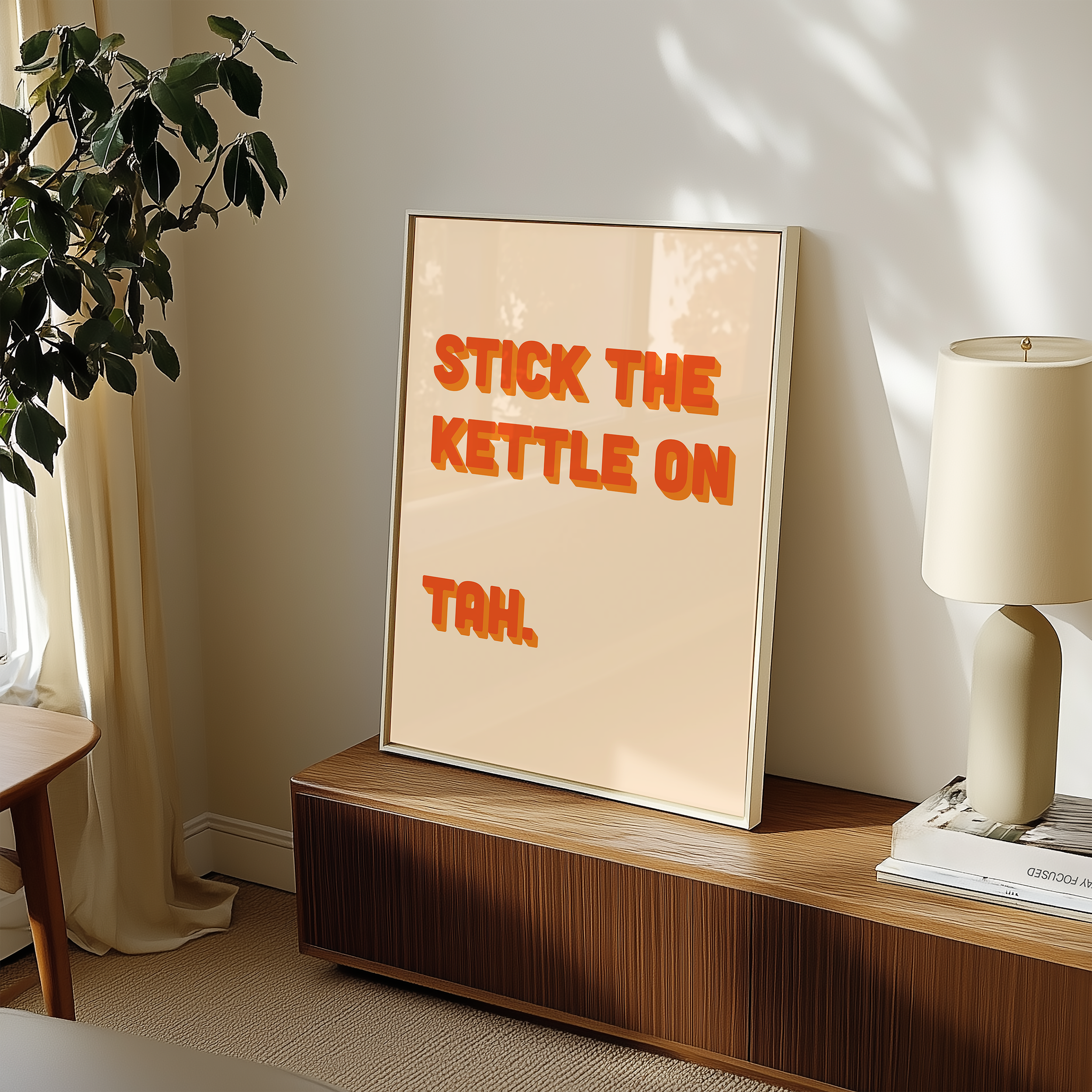 Funny quote print poster that says "Stick the Kettle On Tah" in two tone retro orange font. British humour poster