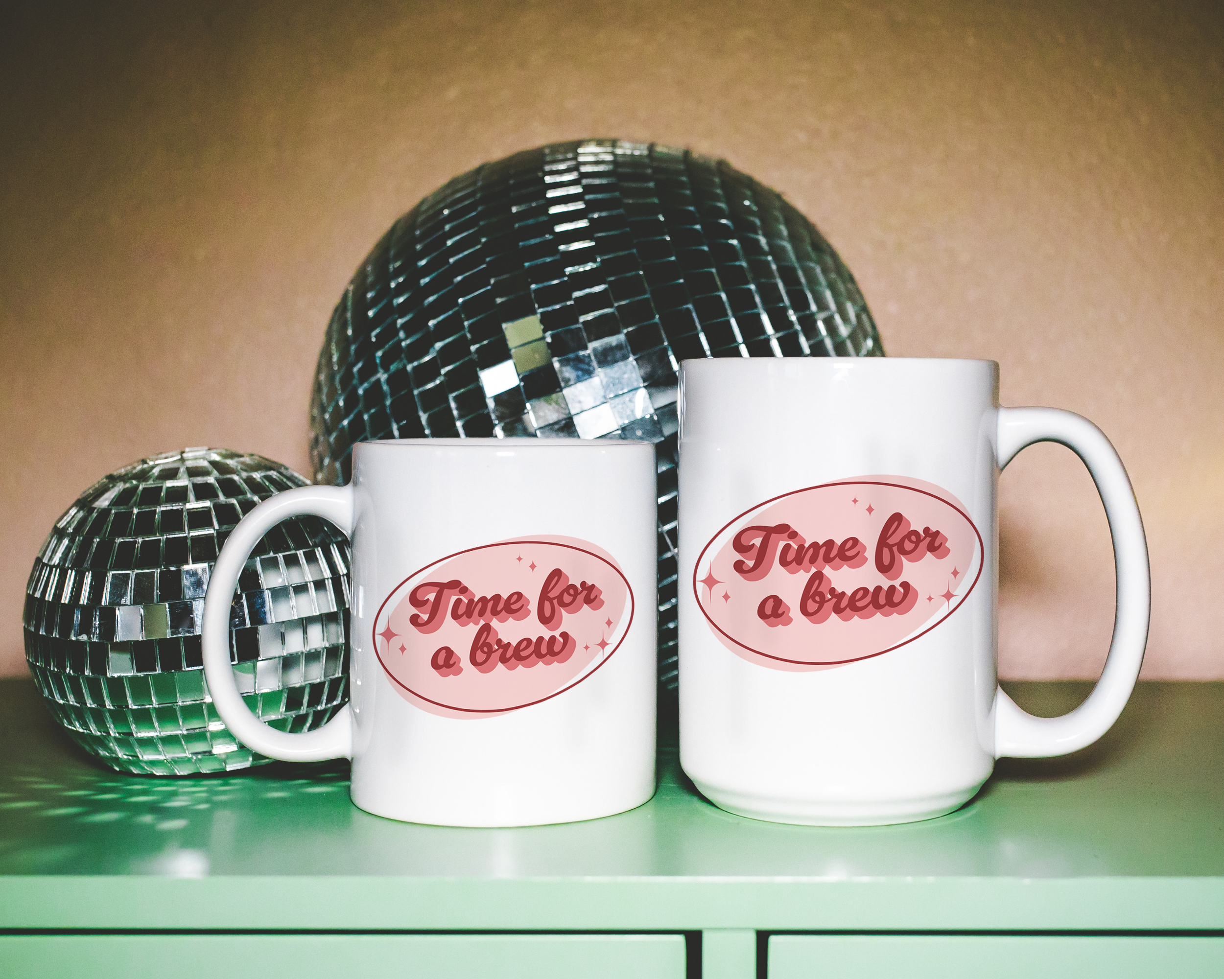 White coffee mug that says "time for a brew" in a retro vintage font that's pink. Available in 11oz and 15oz