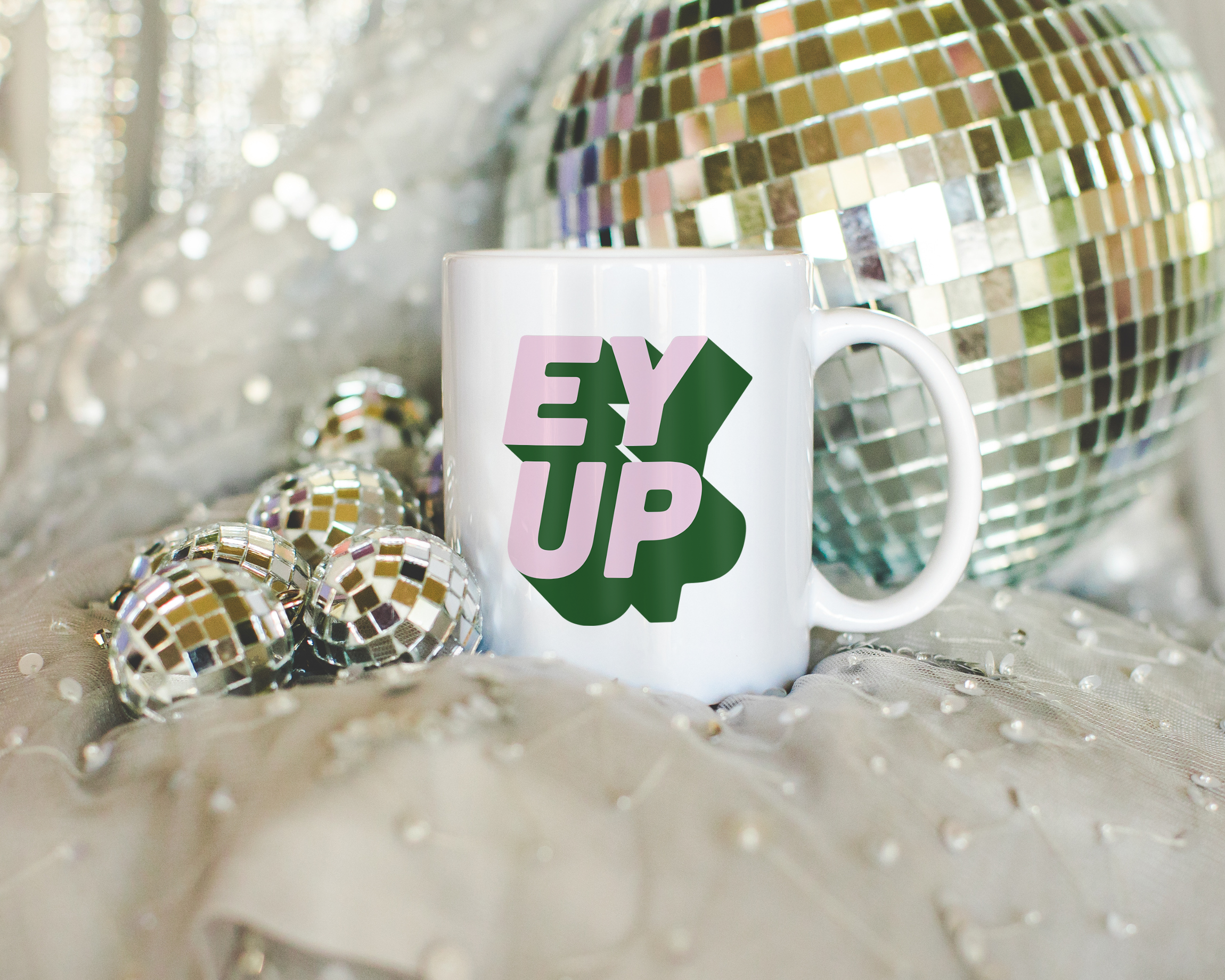 Sassy dopamine decor White coffee mug that says "ey up" in a retro two tone vintage style pink and green font. Available in 11oz and 15oz. British humour