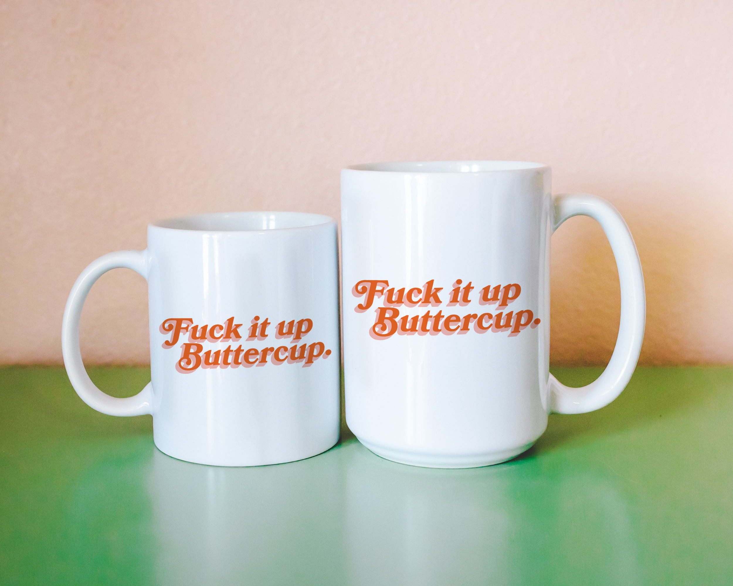 Sassy dopamine decor White coffee mug that says "Fuck it up buttercup" in a retro vintage font that's orange. Available in 11oz and 15oz