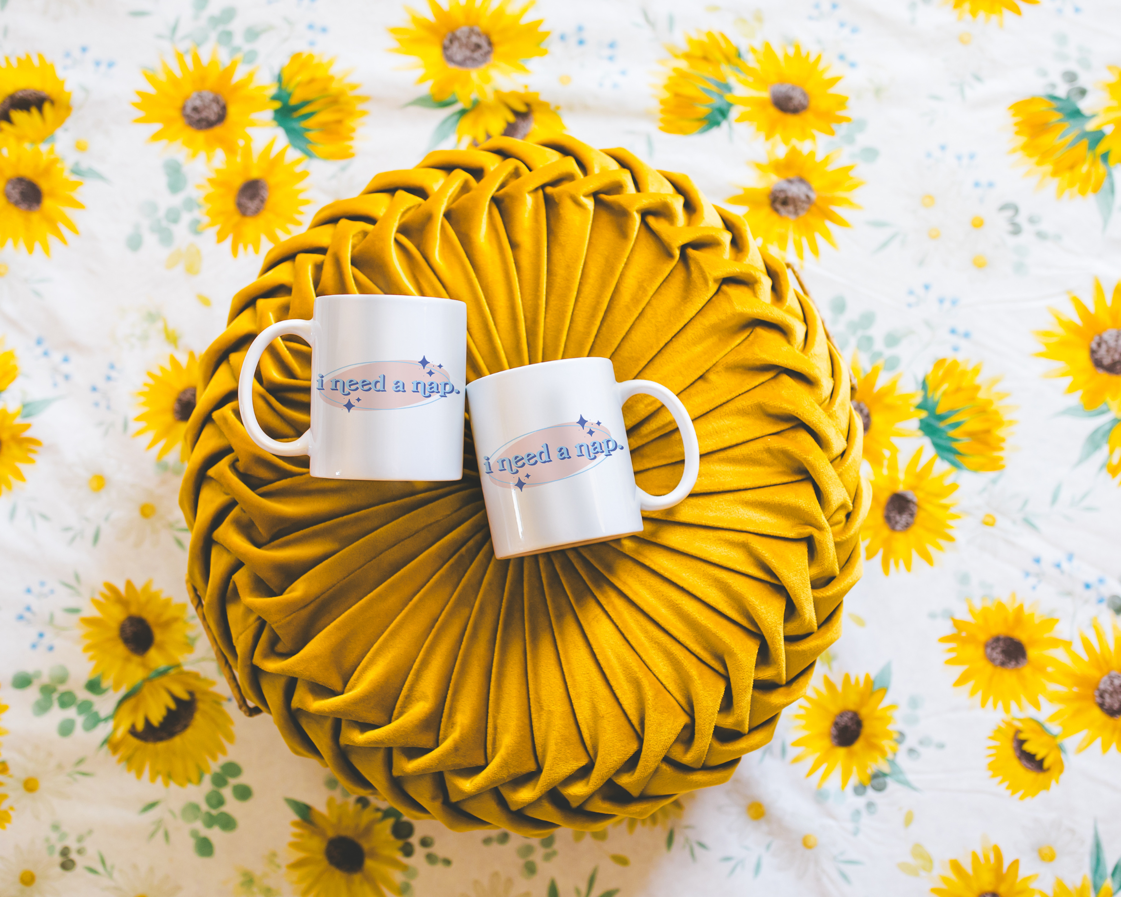 White coffee mug that says "I need a nap" in a retro vintage font that's blue and pink. Available in 11oz and 15oz