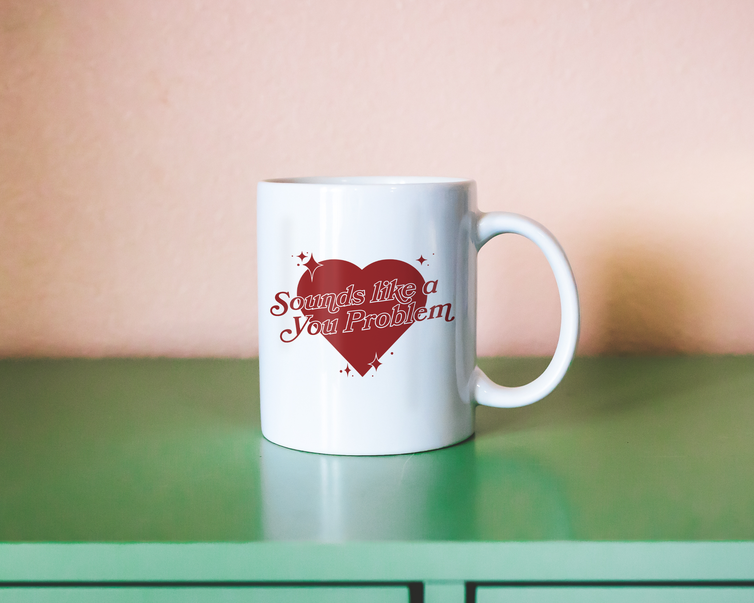 Sassy dopamine decor White coffee mug that says "Sounds like a you problem" in a retro vintage style heart that's red with a retro font.. Available in 11oz and 15oz