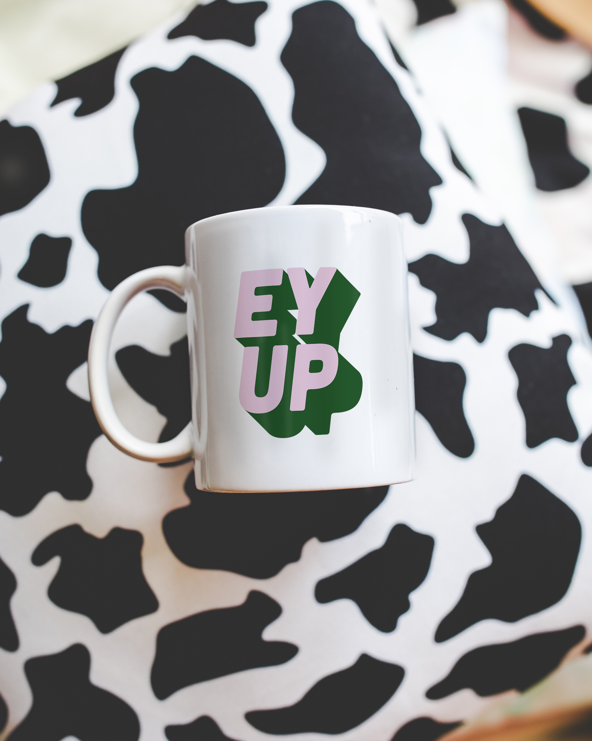 Sassy dopamine decor White coffee mug that says "ey up" in a retro two tone vintage style pink and green font. Available in 11oz and 15oz. British humour