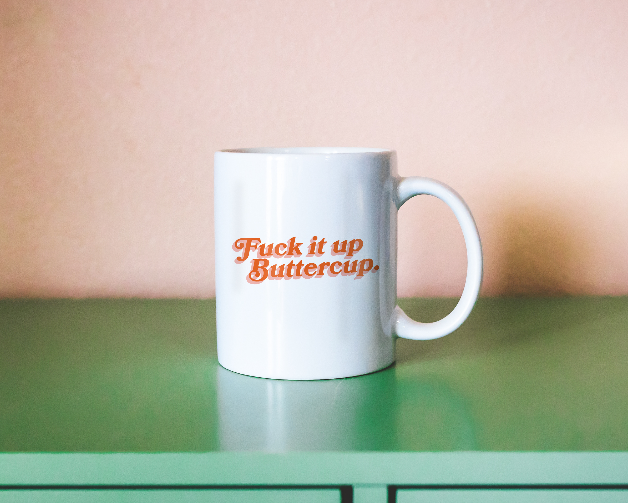 Sassy dopamine decor White coffee mug that says "Fuck it up buttercup" in a retro vintage font that's orange. Available in 11oz and 15oz