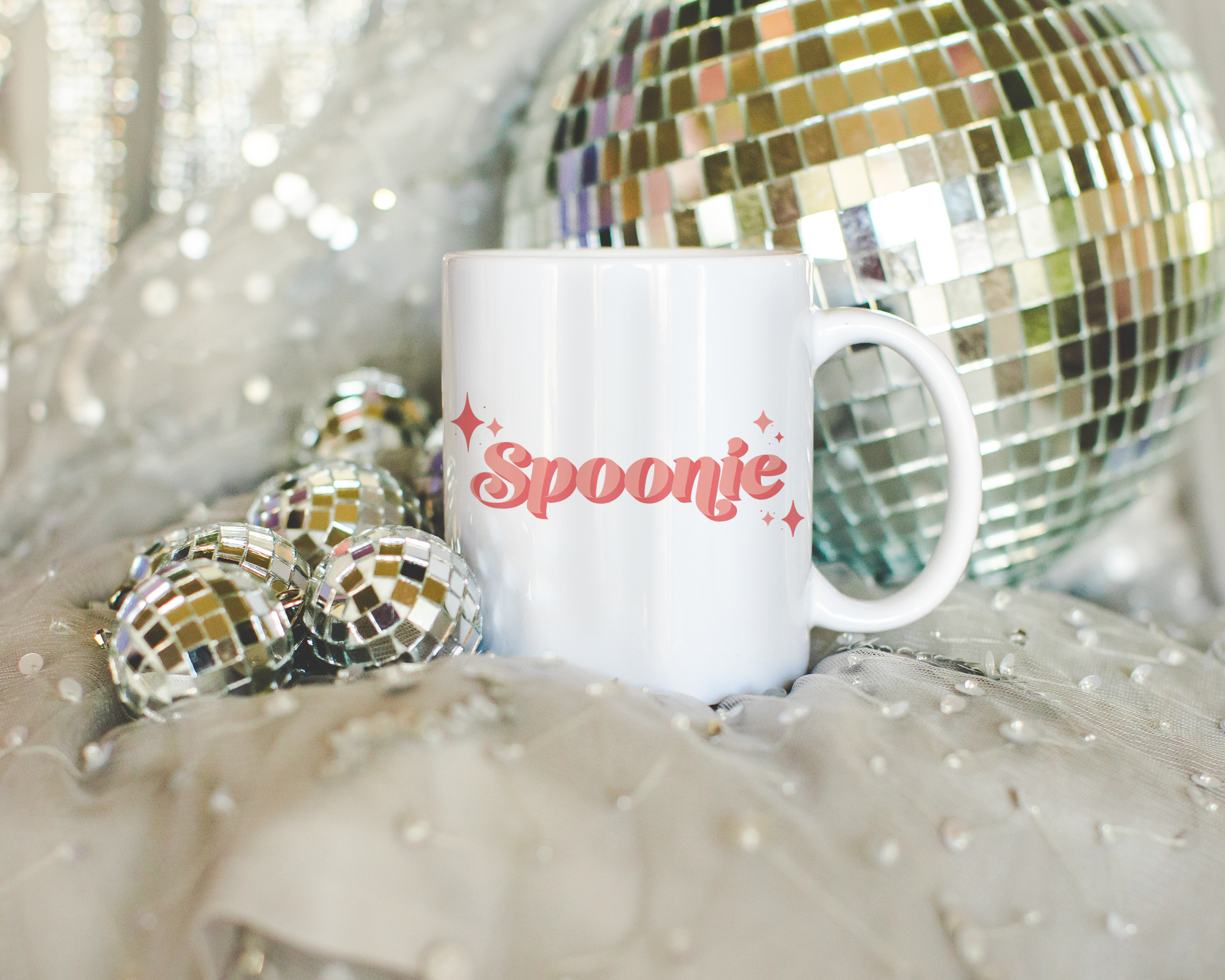 Sassy dopamine decor White coffee mug that says "Spoonie" in a retro vintage style pink font. Available in 11oz and 15oz