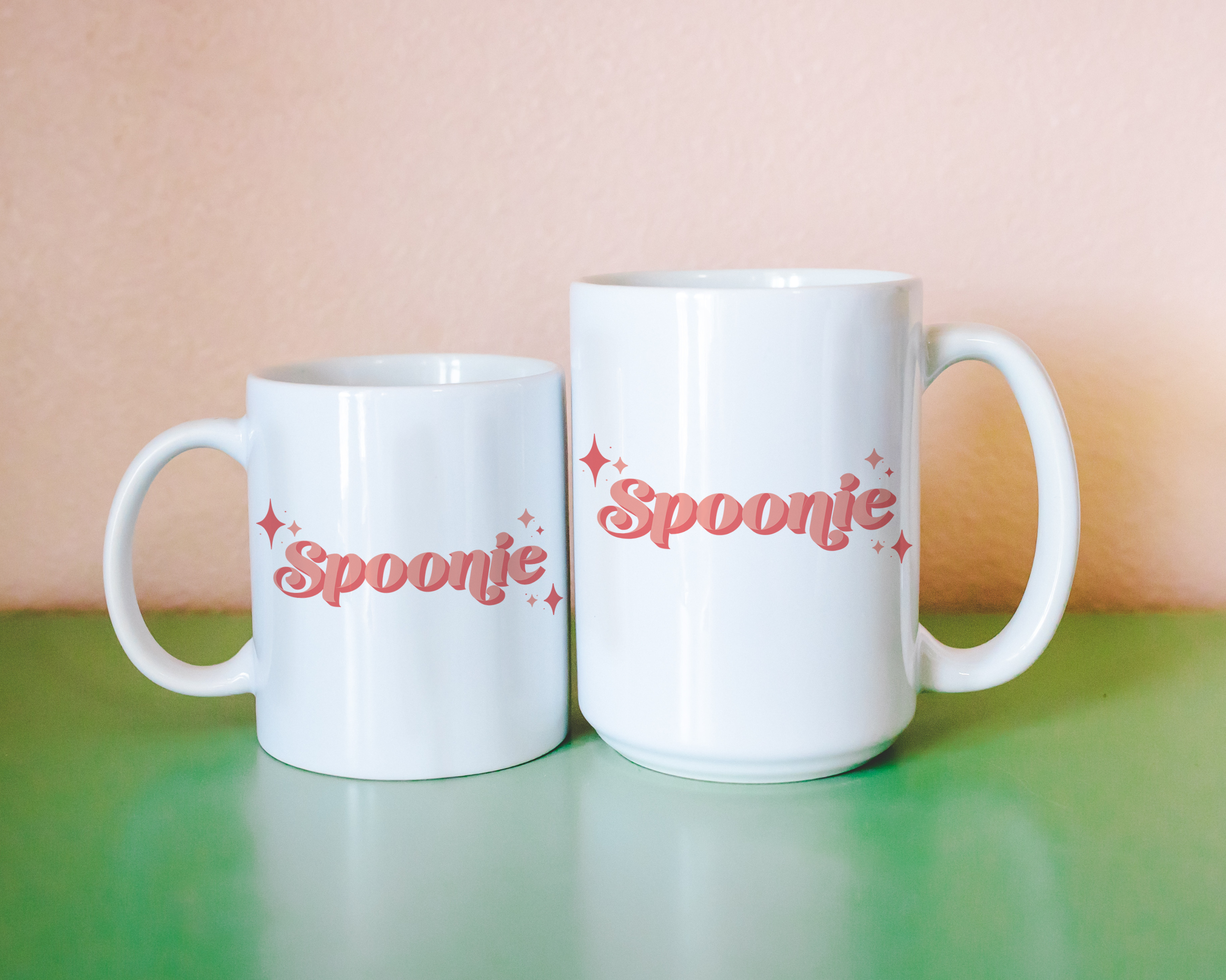 Sassy dopamine decor White coffee mug that says "Spoonie" in a retro vintage style pink font. Available in 11oz and 15oz