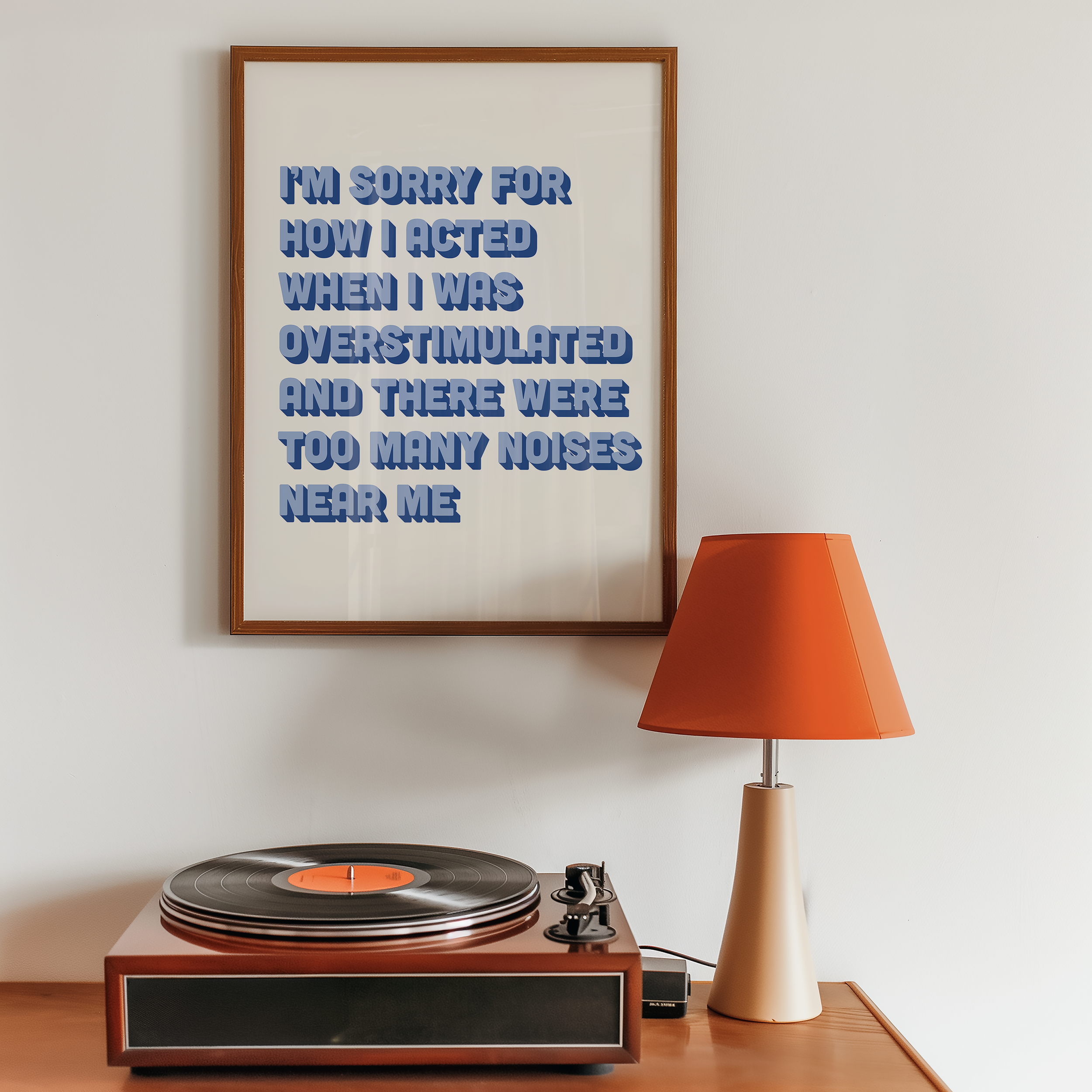 Funny neurodivergent print about being overstimulated that says “I’m sorry for how I acted when I was overstimulated and there were too many noises near me.” in two tone blue retro font.