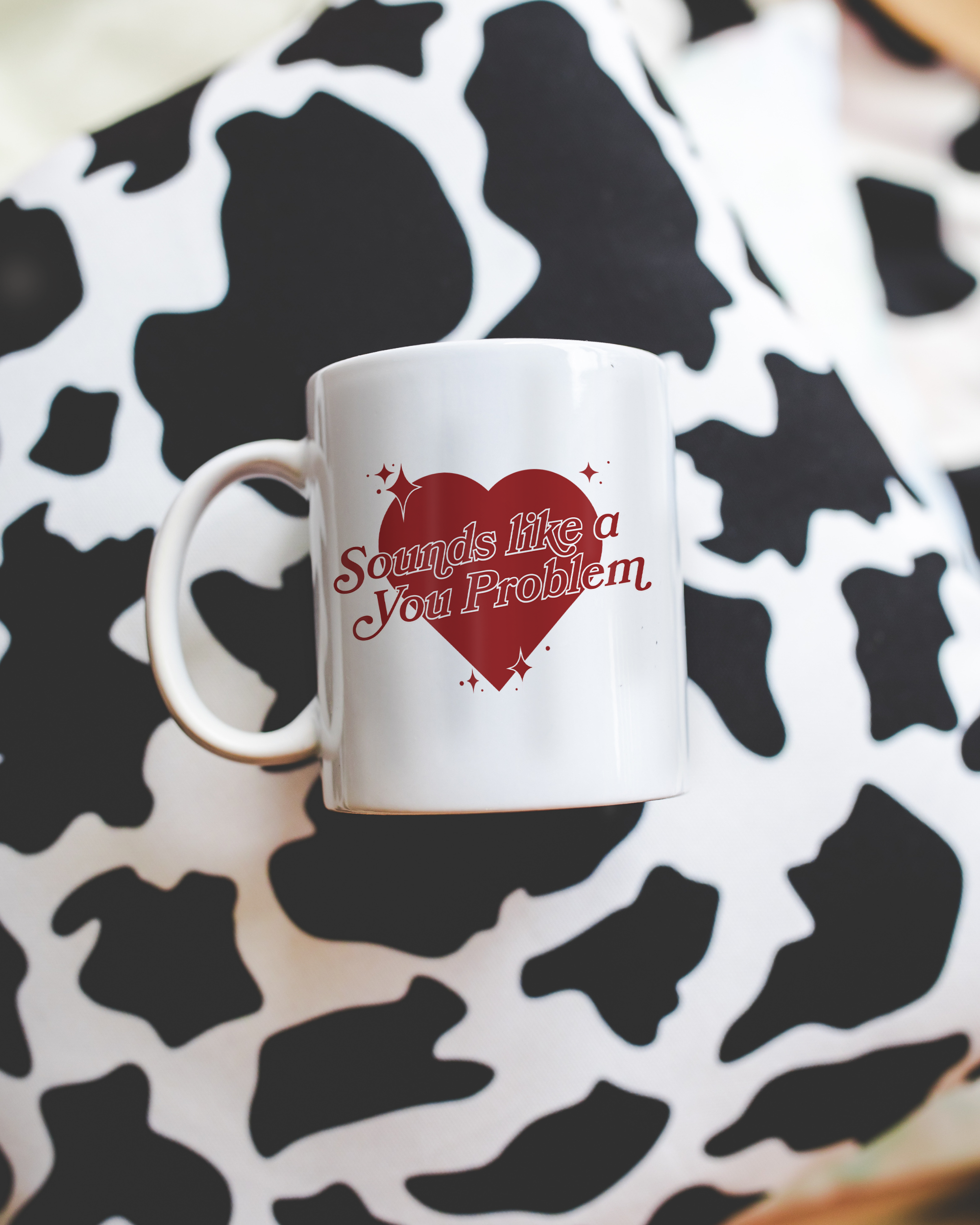 Sassy dopamine decor White coffee mug that says "Sounds like a you problem" in a retro vintage style heart that's red with a retro font.. Available in 11oz and 15oz