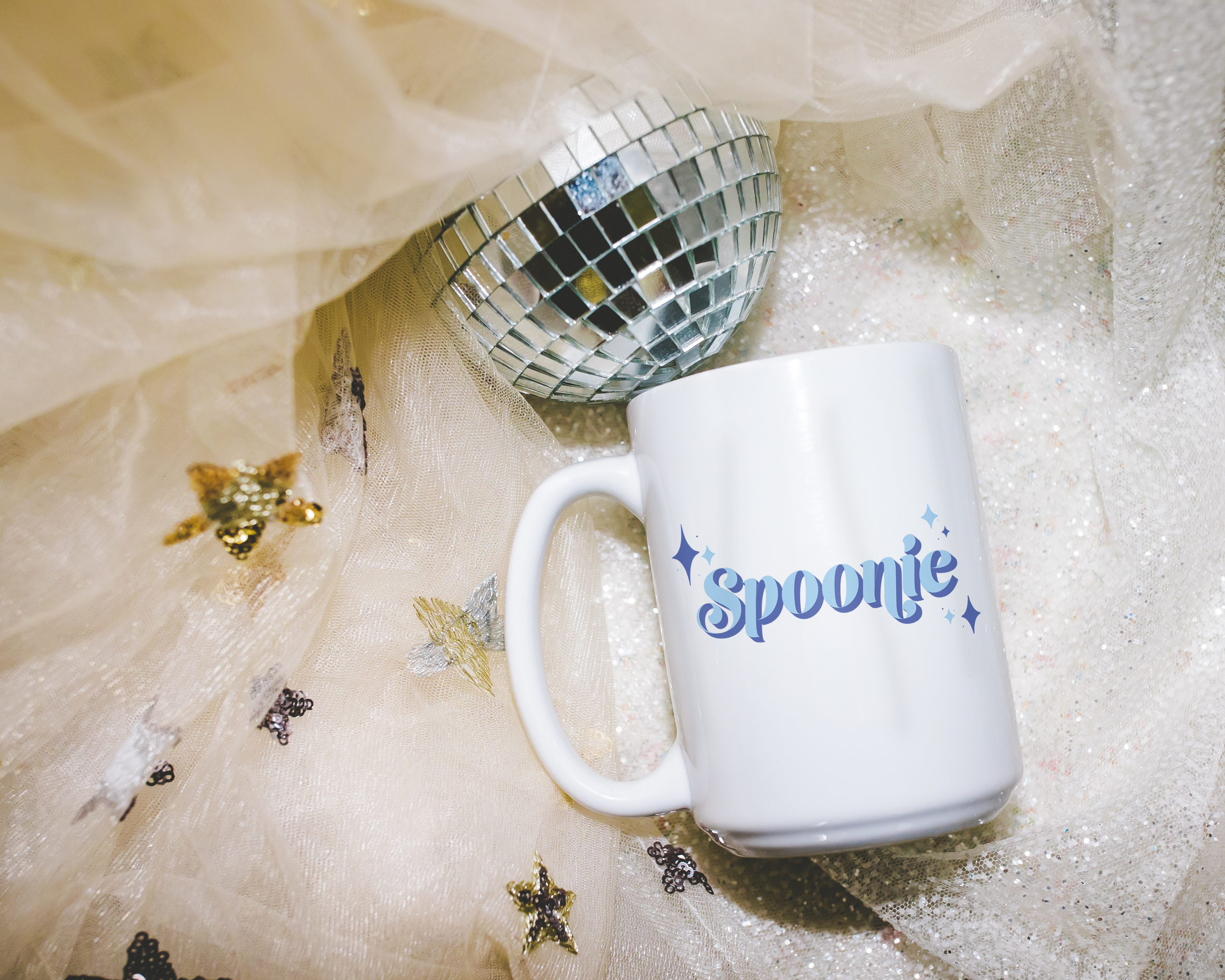 Sassy dopamine decor White coffee mug that says "Spoonie" in a retro vintage style blue font. Available in 11oz and 15oz