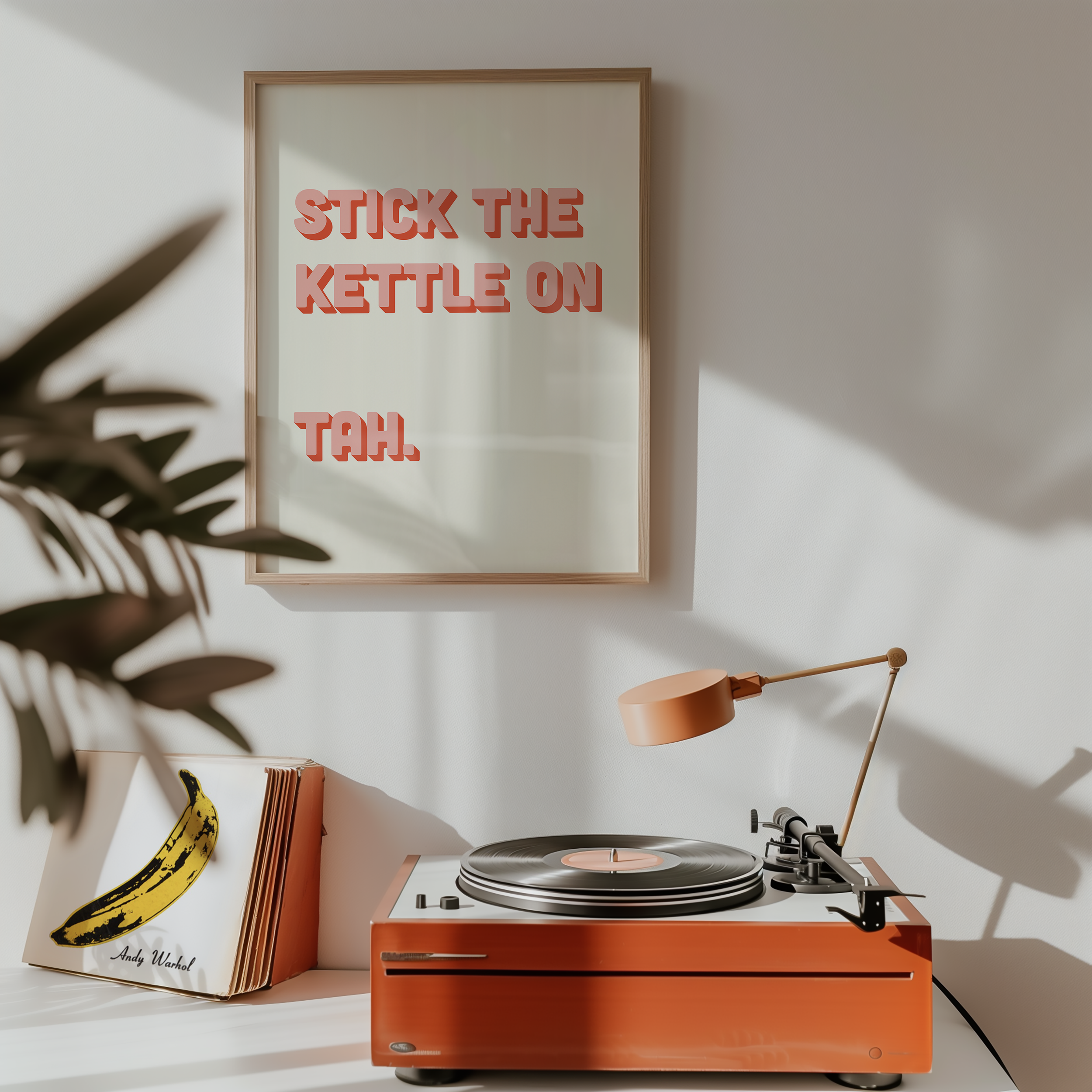 Funny quote print poster that says "Stick the Kettle On Tah" in two tone retro pink font. British humour poster