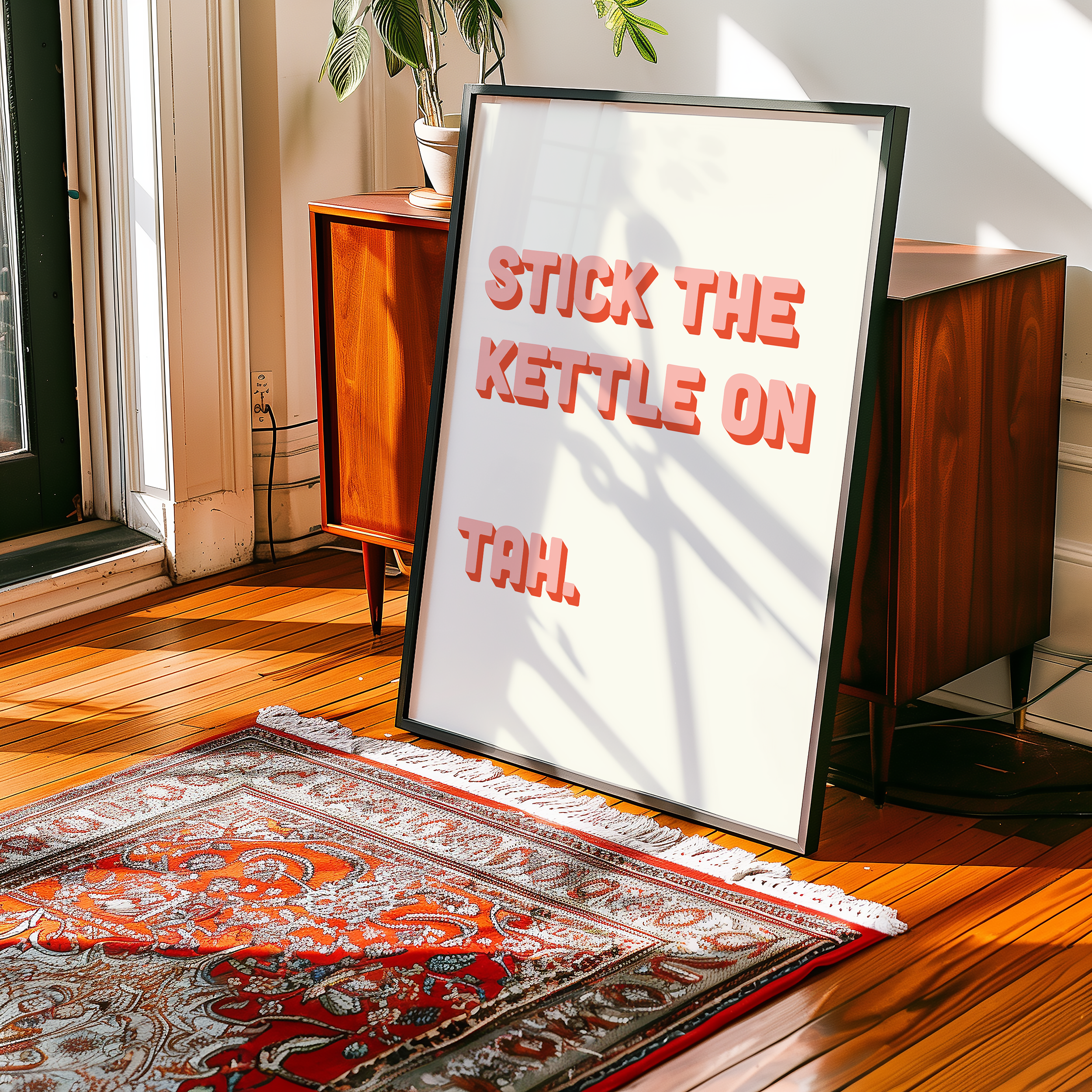 Funny quote print poster that says "Stick the Kettle On Tah" in two tone retro pink font. British humour poster