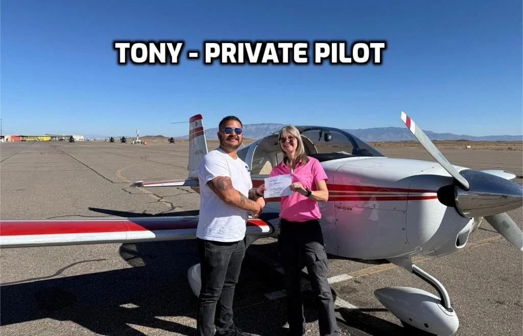 Man and woman standing in front of a small white and red airplane on an airfield, holding a document, with the text 'Tony - Private Pilot' at the top.