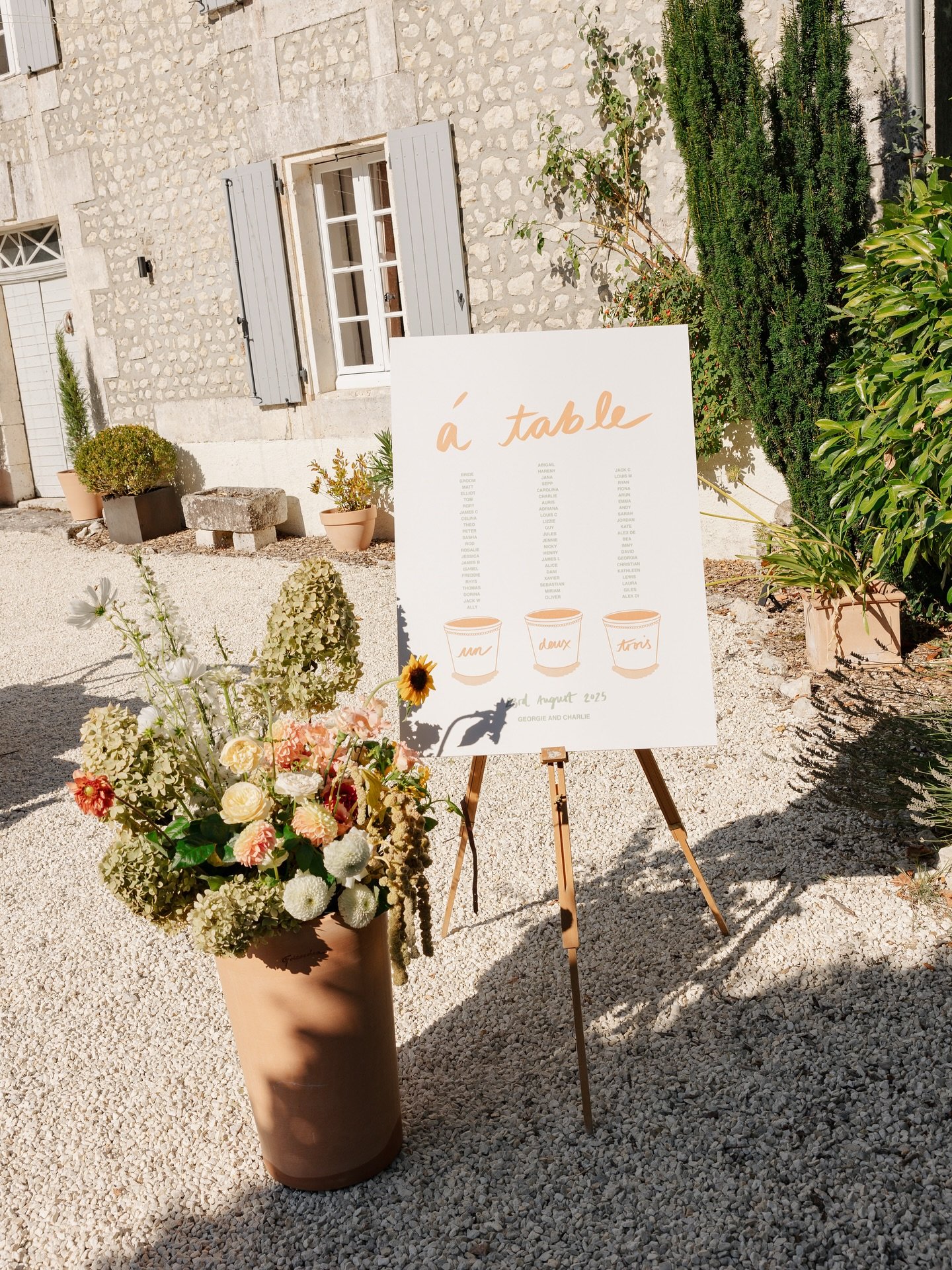 ✨ &aacute; table, bisous! A welcome sign and table plan designed around Georgie &amp; Charlie&rsquo;s beautiful sun-soaked French wedding, set amongst the terracotta pots of beautiful @manoir_beaulieu. On-the-day signs are a show-stopping detail to a