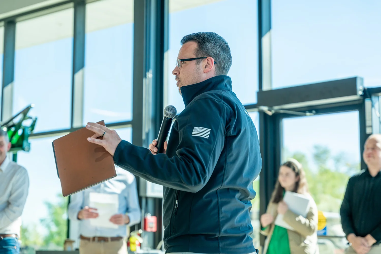 Brodie Milne speaking at a company event