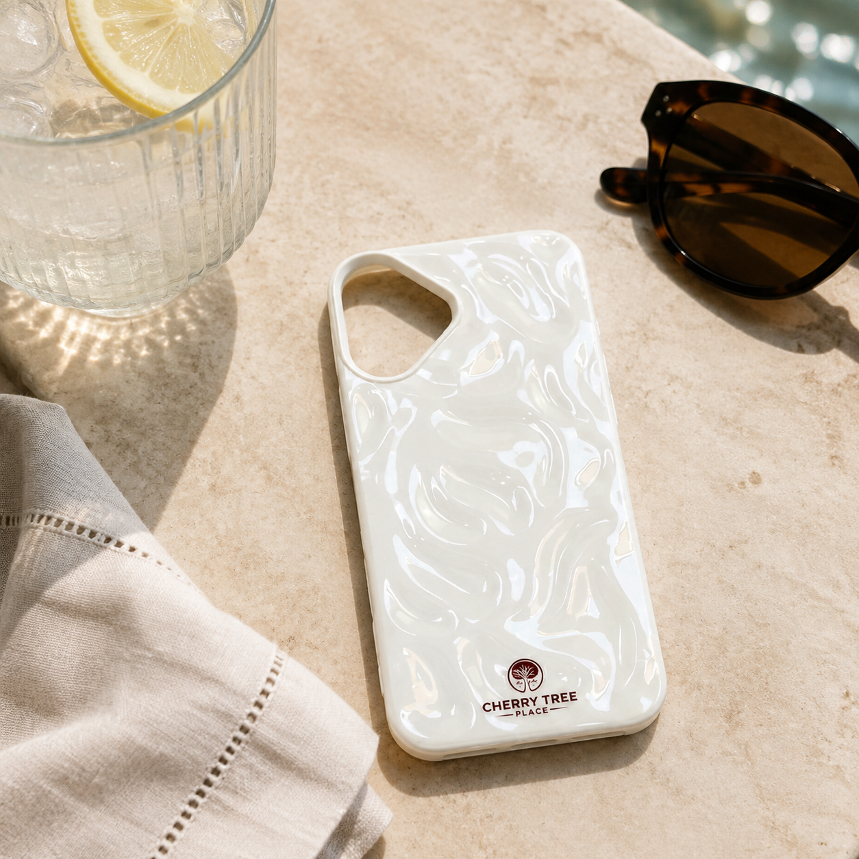 Pearlescent ripple case at seaside café.png