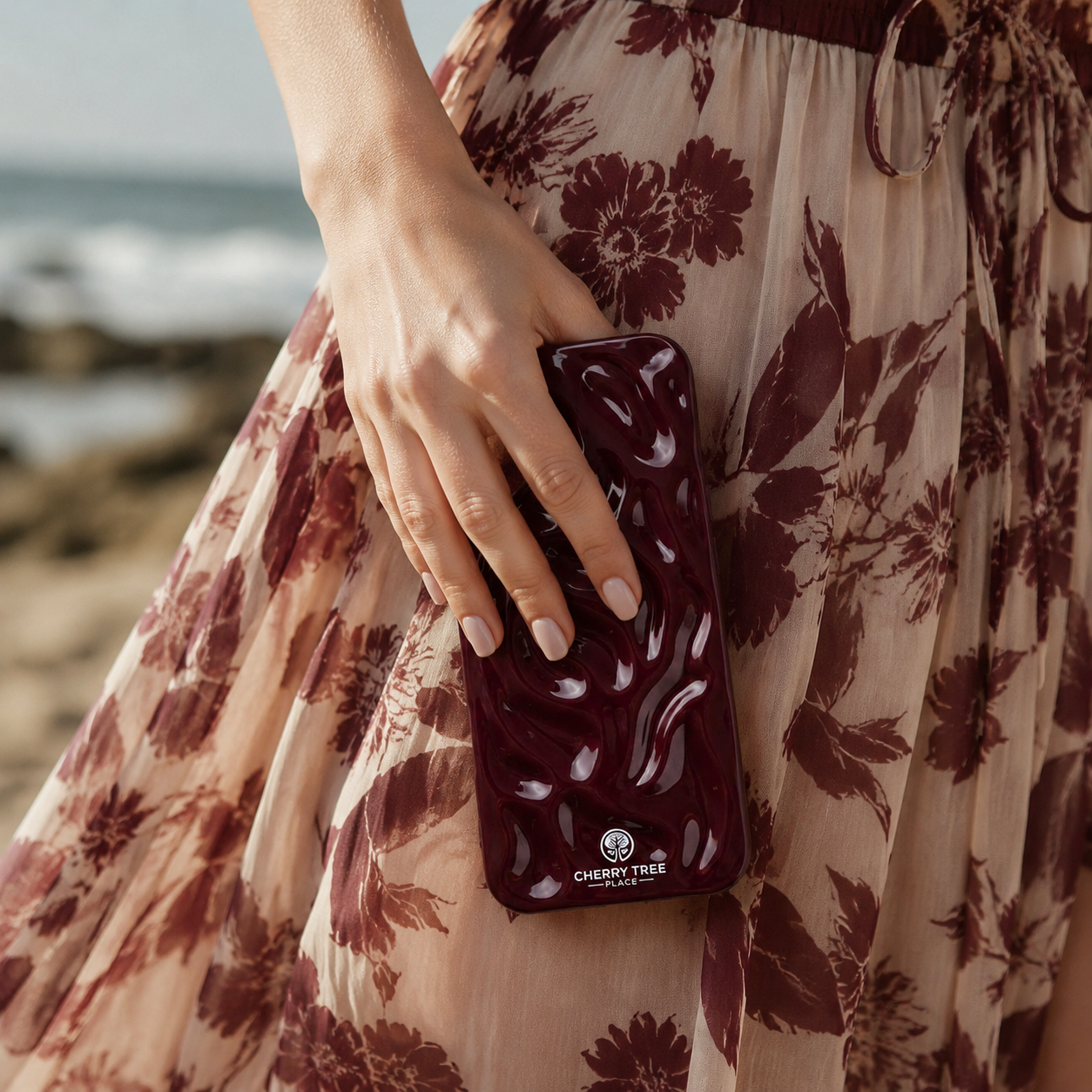 Burgundy ripple case with floral beach styling.png