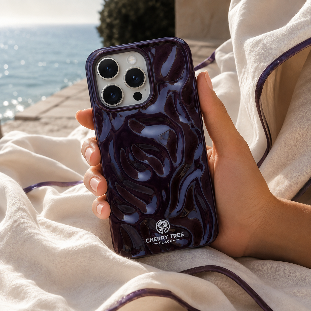 Aubergine phone case against seaside linen.png